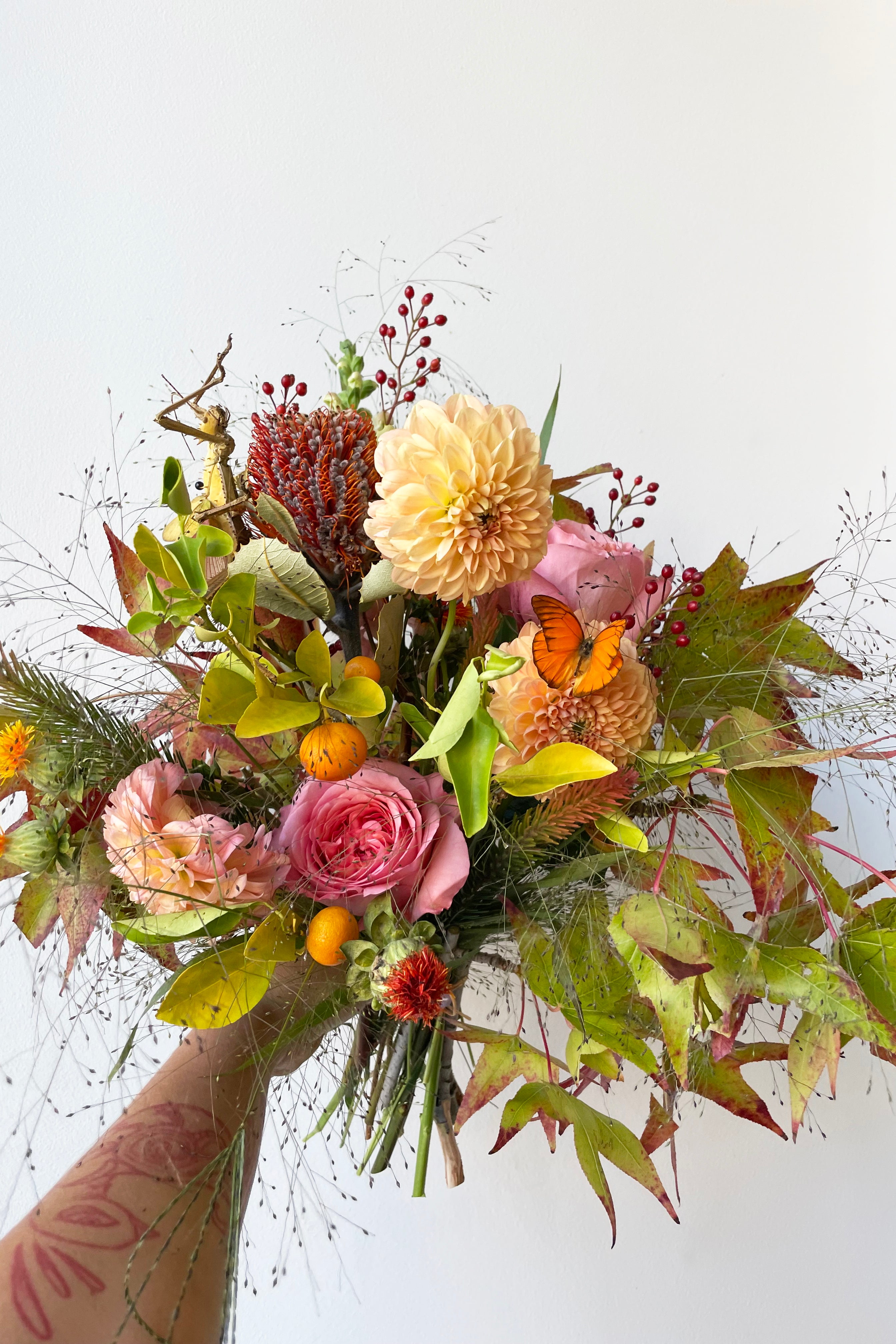 An example of $125 Harvest Moon with a butterfly addition from Sprout Home Floral #size_$125