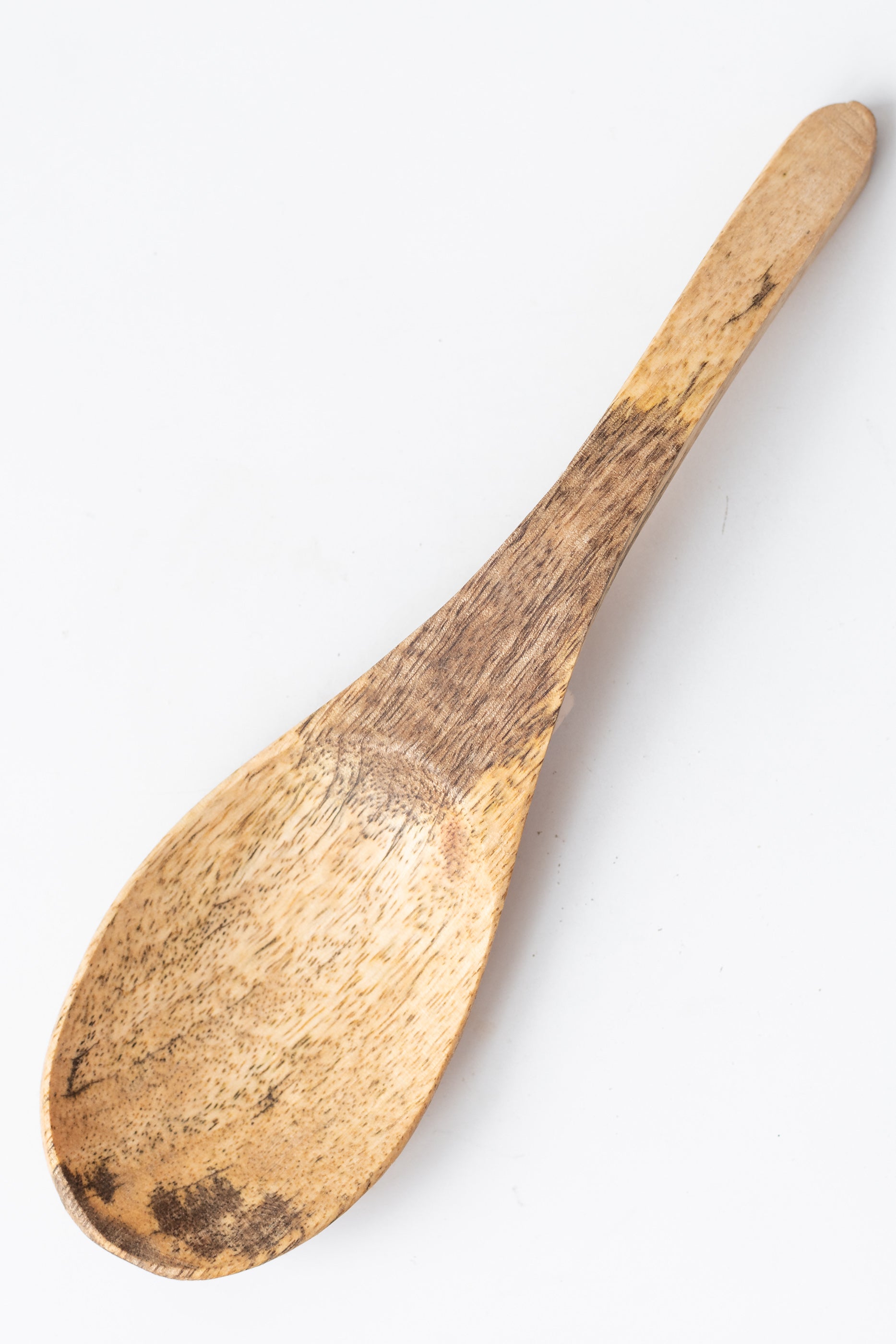Fog Linen Work large mango wood serving spoon on a white surface
