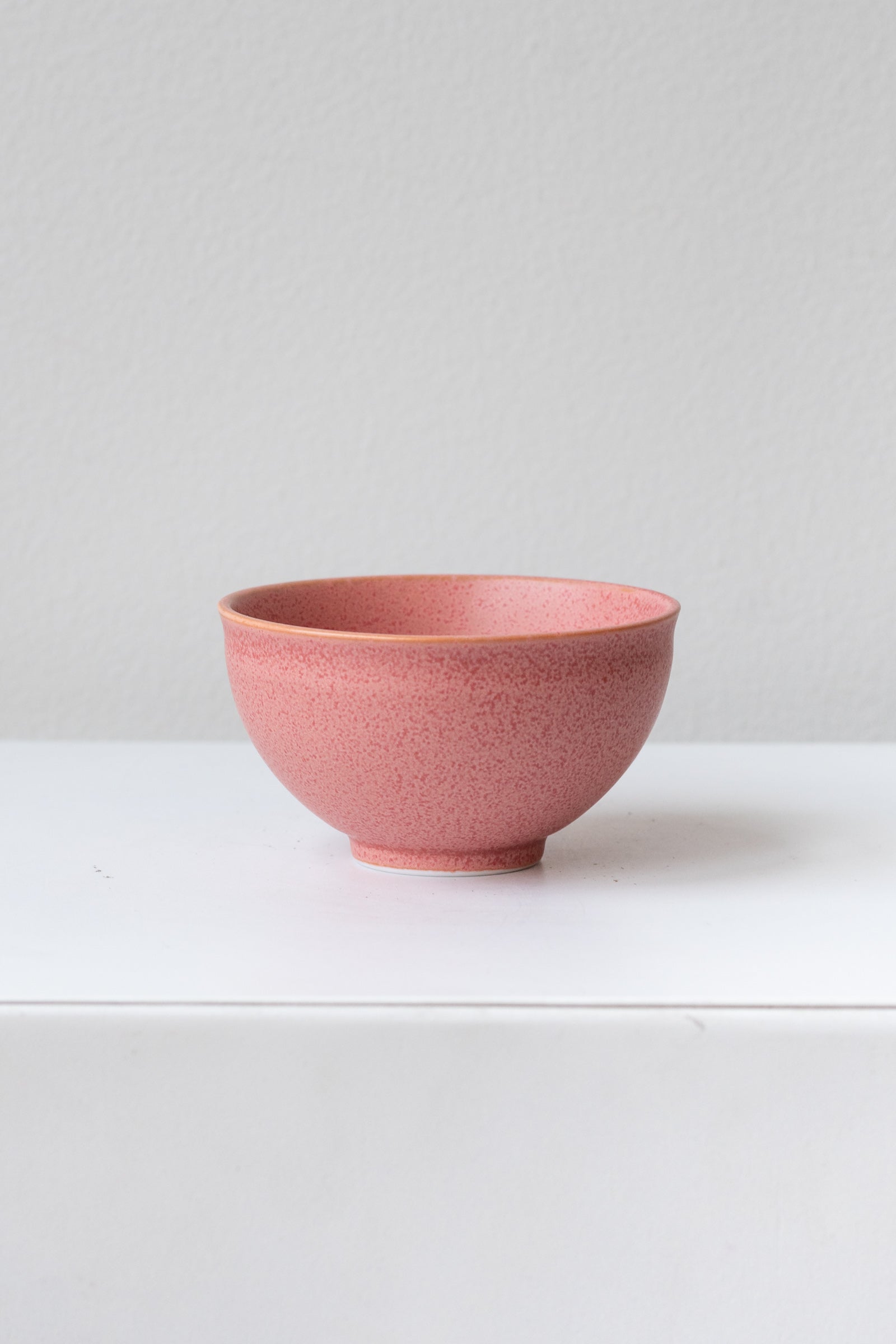 Hot pink ishi teacup by Miya Company Inc sits on a white surface in a white room ©Sprout Home