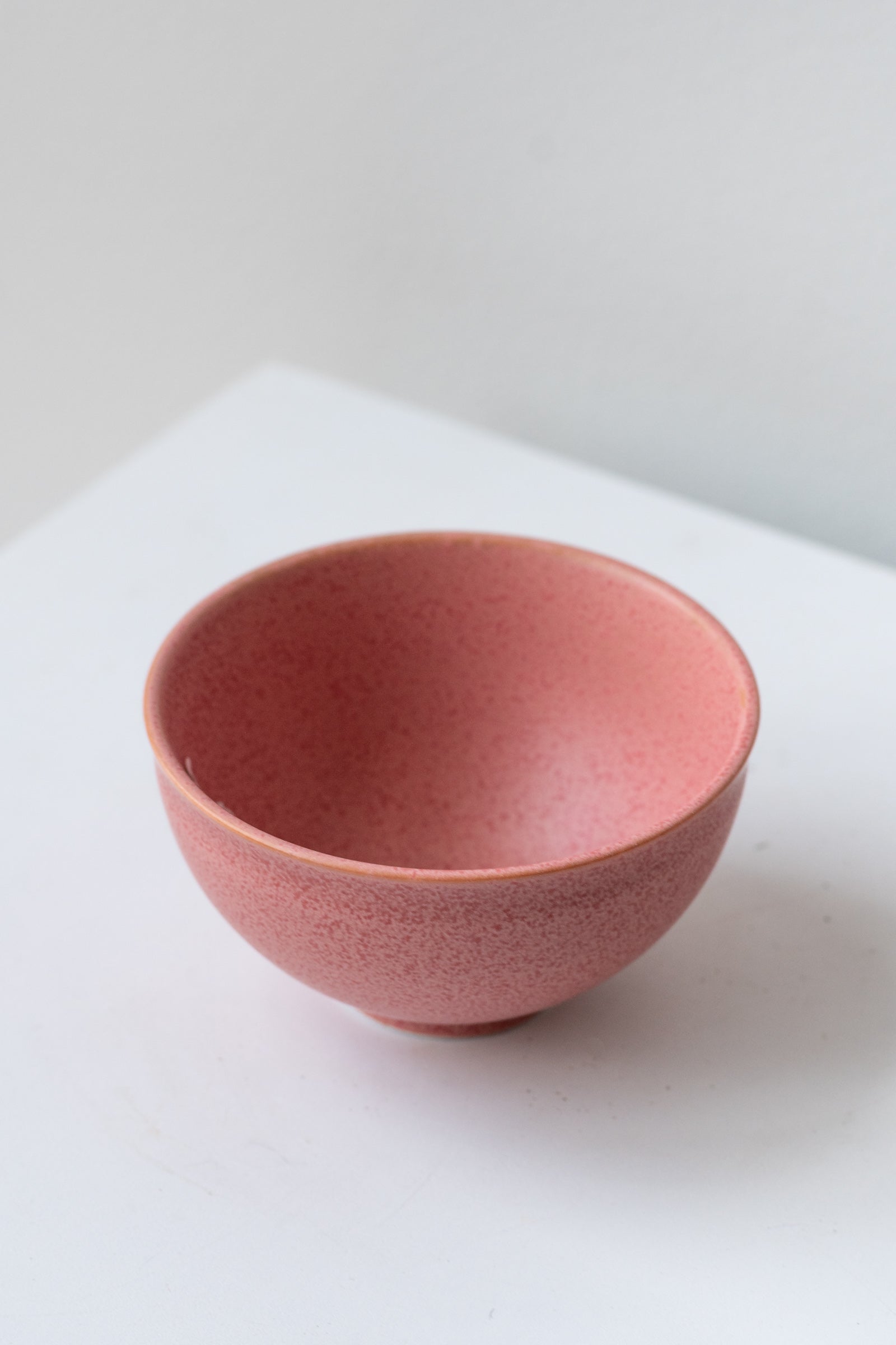 Hot pink ishi teacup by Miya Company Inc sits on a white surface in a white room ©Sprout Home