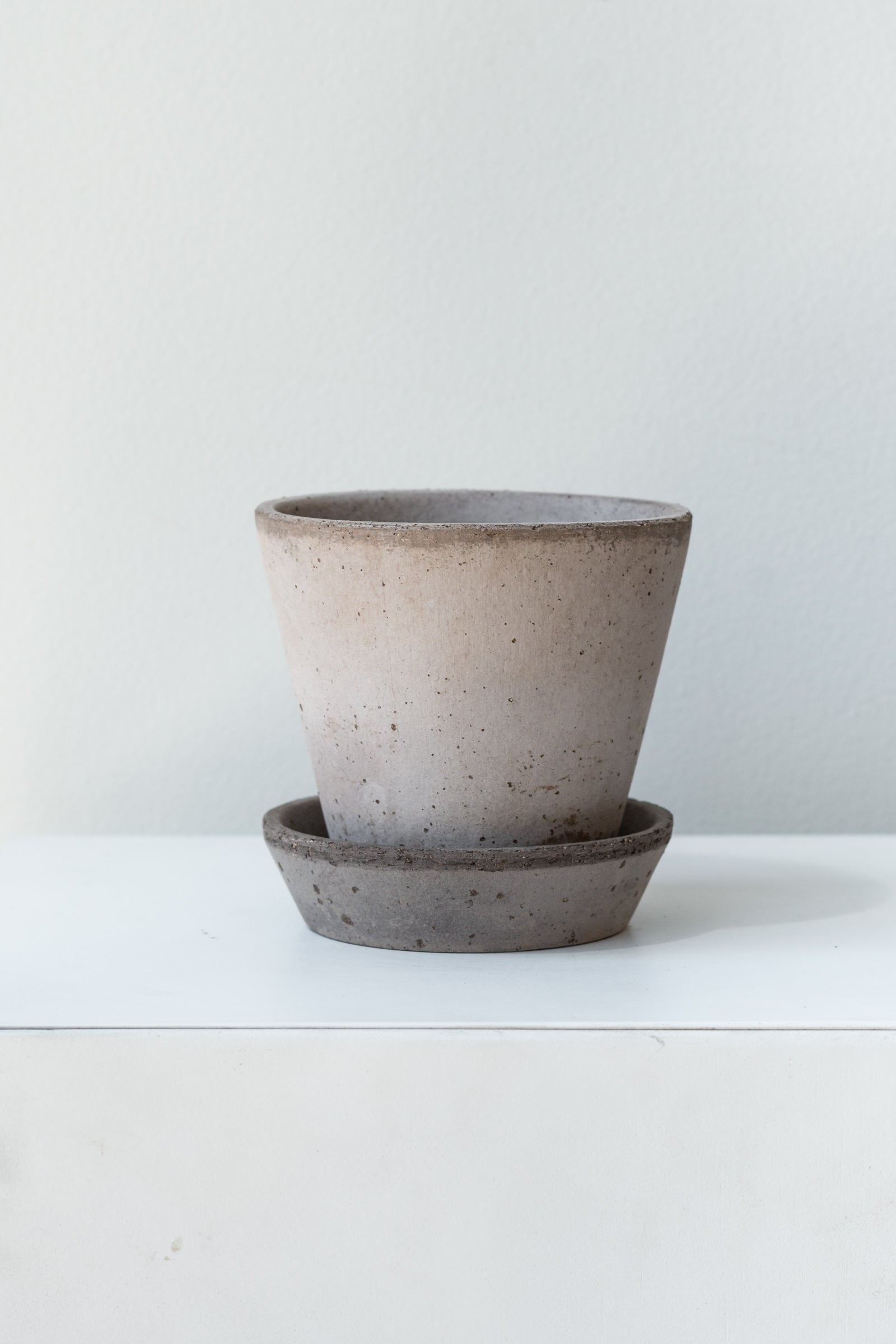 Grey 3.9 inch Julie Pot by Bergs Potter on a white surface in a white room ©Sprout Home
