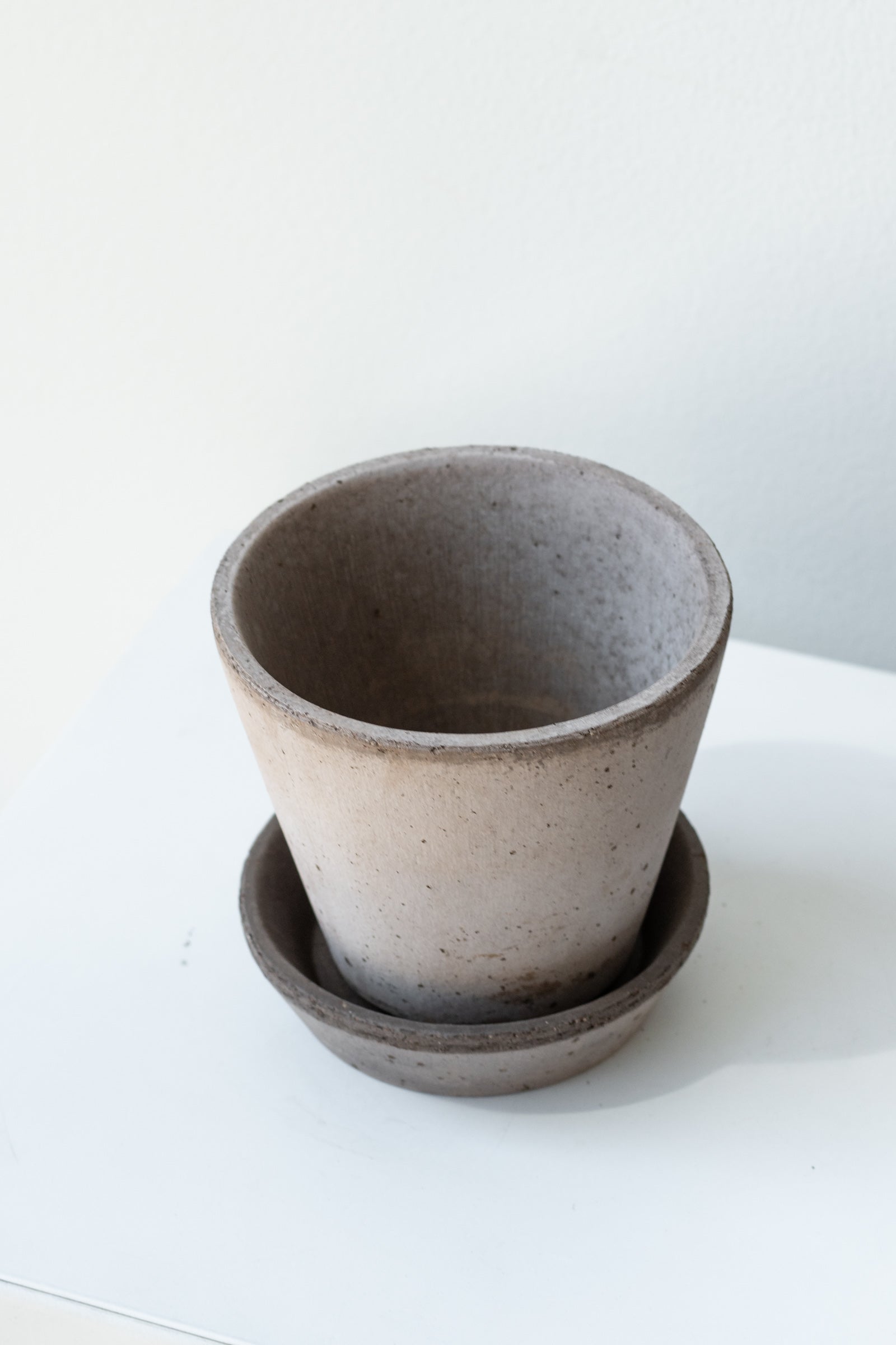 Grey 3.9 inch Julie Pot by Bergs Potter on a white surface in a white room ©Sprout Home