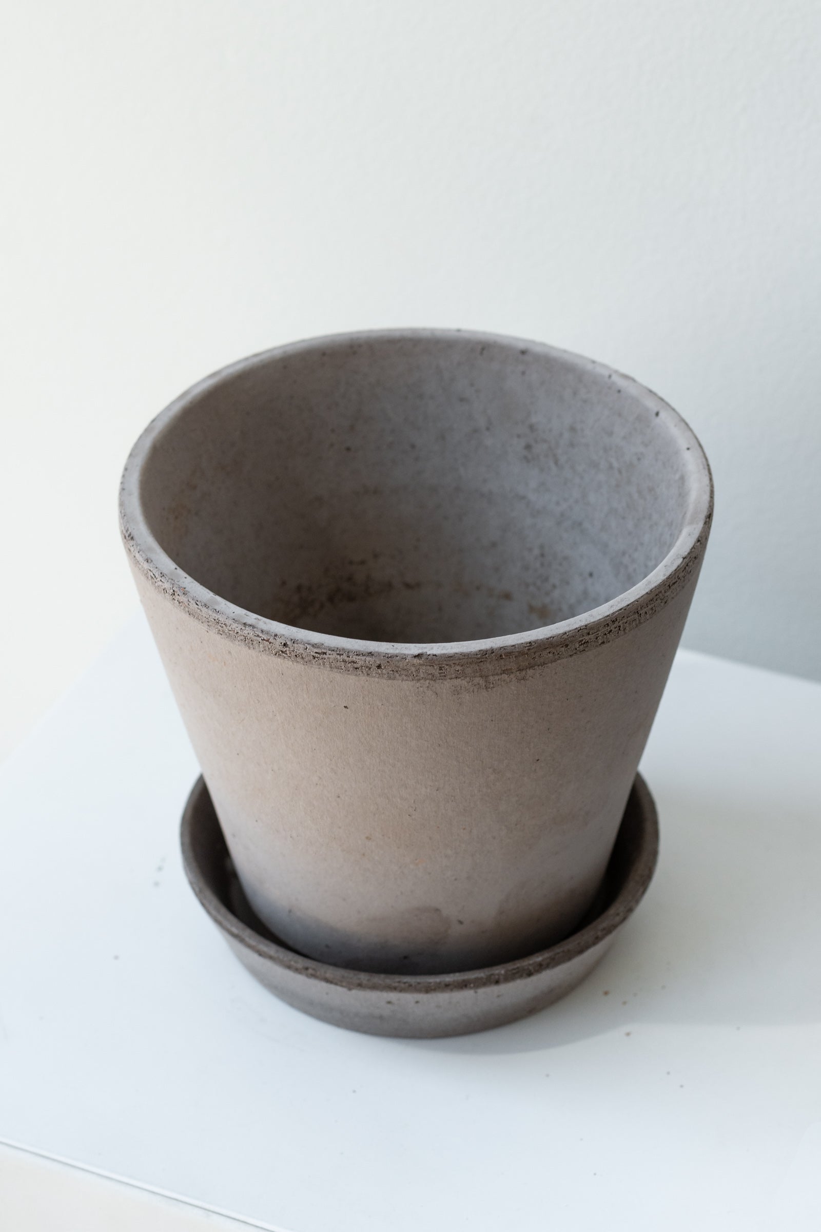 Grey 5.5 inch Julie Pot by Bergs Potter on a white surface in a white room ©Sprout Home