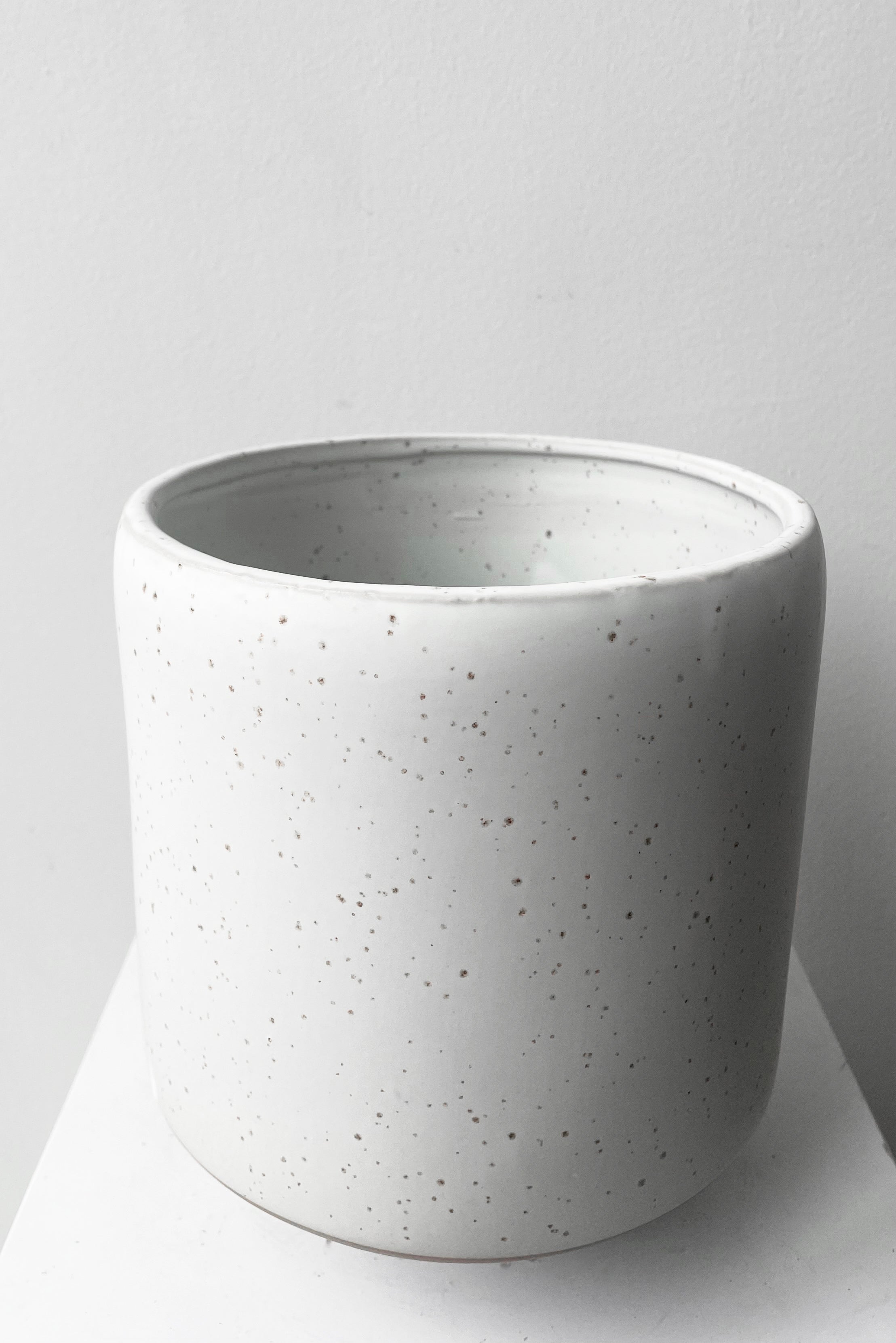 A slightly overhead view of Hagi Cachepot Vase white against white backdrop