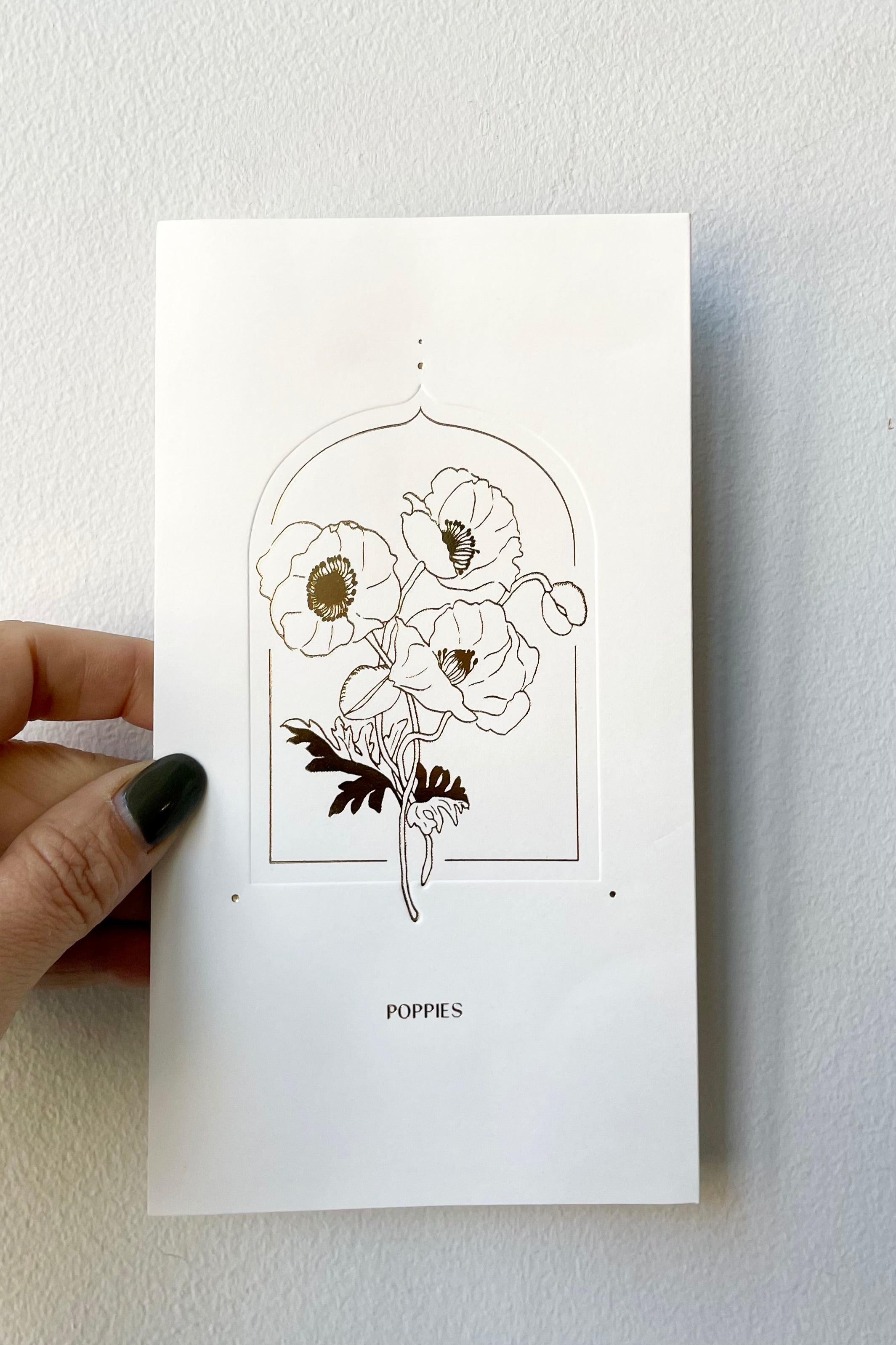 The front gold foil image of poppies on the poppies pop-up card.