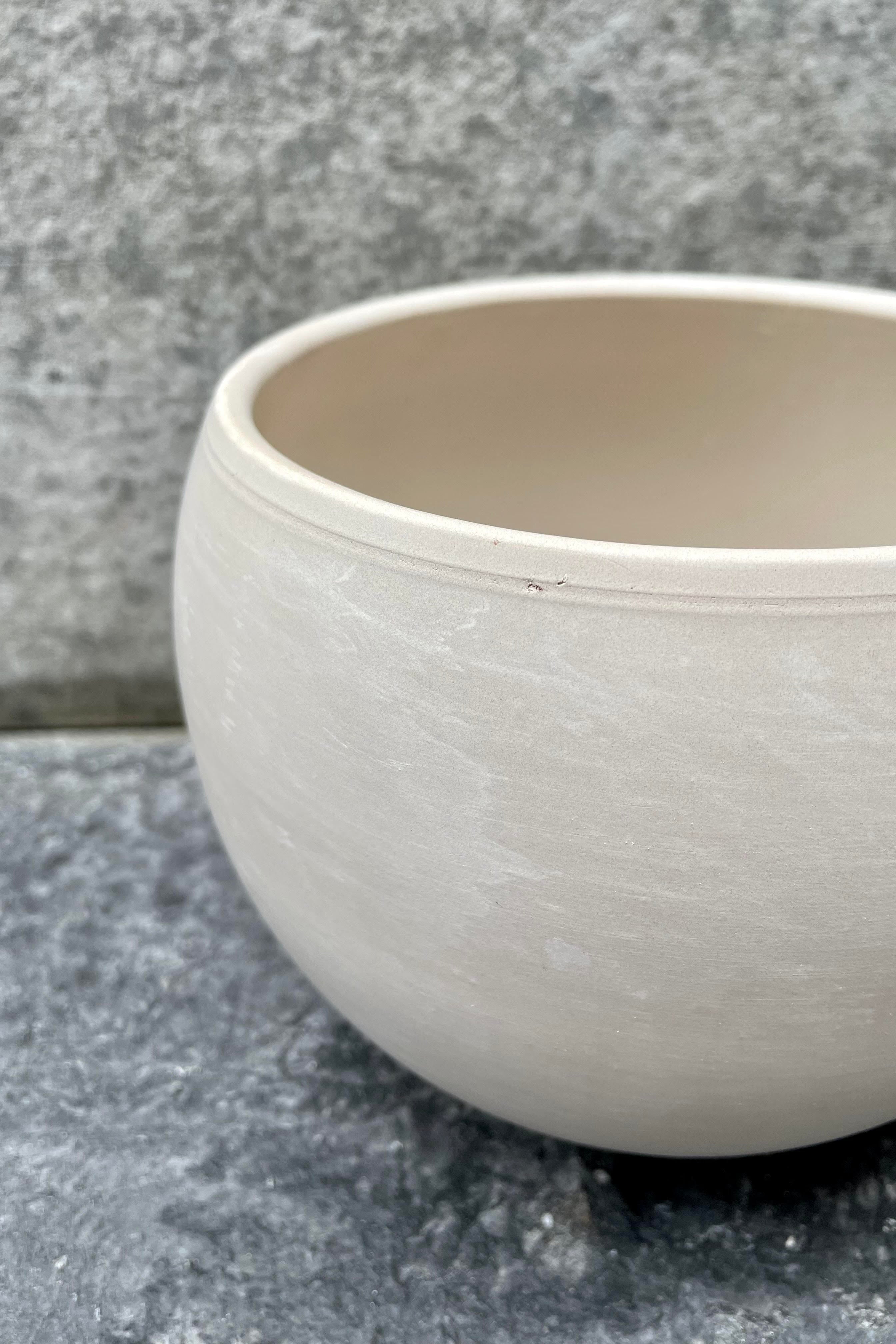 A detailed view of the granite Luna Sphere Pot in 6.5 inches.
