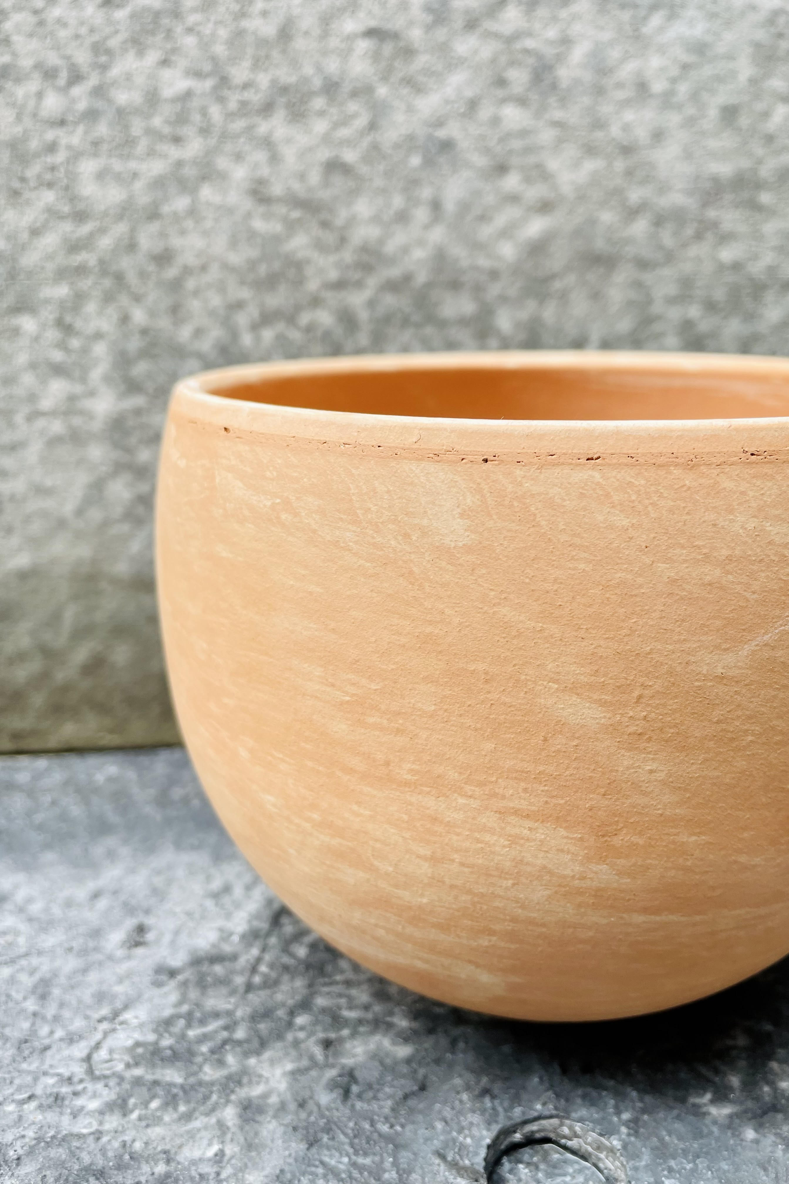 An up-close image of the 5.25" light marble Luna Sphere pot.