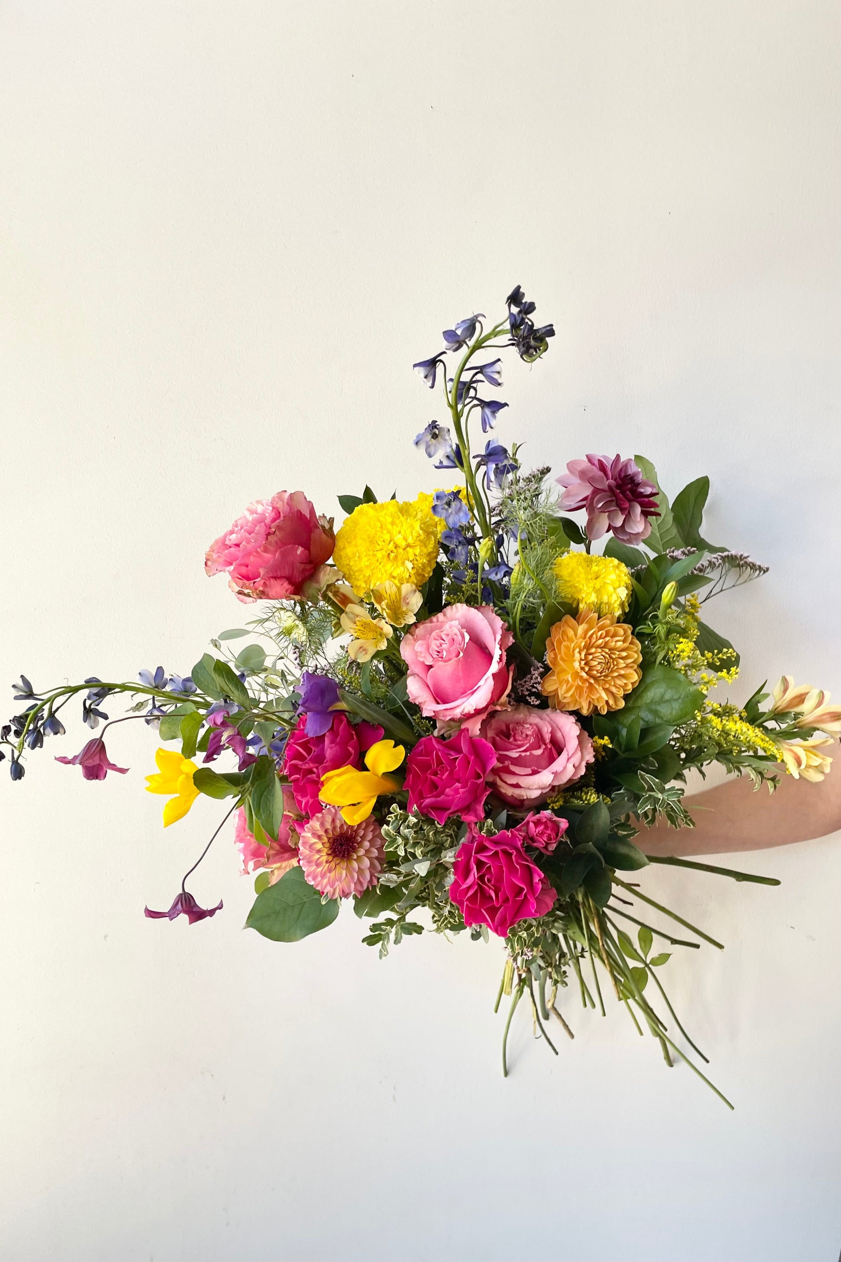 Bright and multi colored floral arrangement 'Midday' with bright roses, with electric shades created by Sprout Home for delivery or pick up. ©Sprout Home #size_$200
