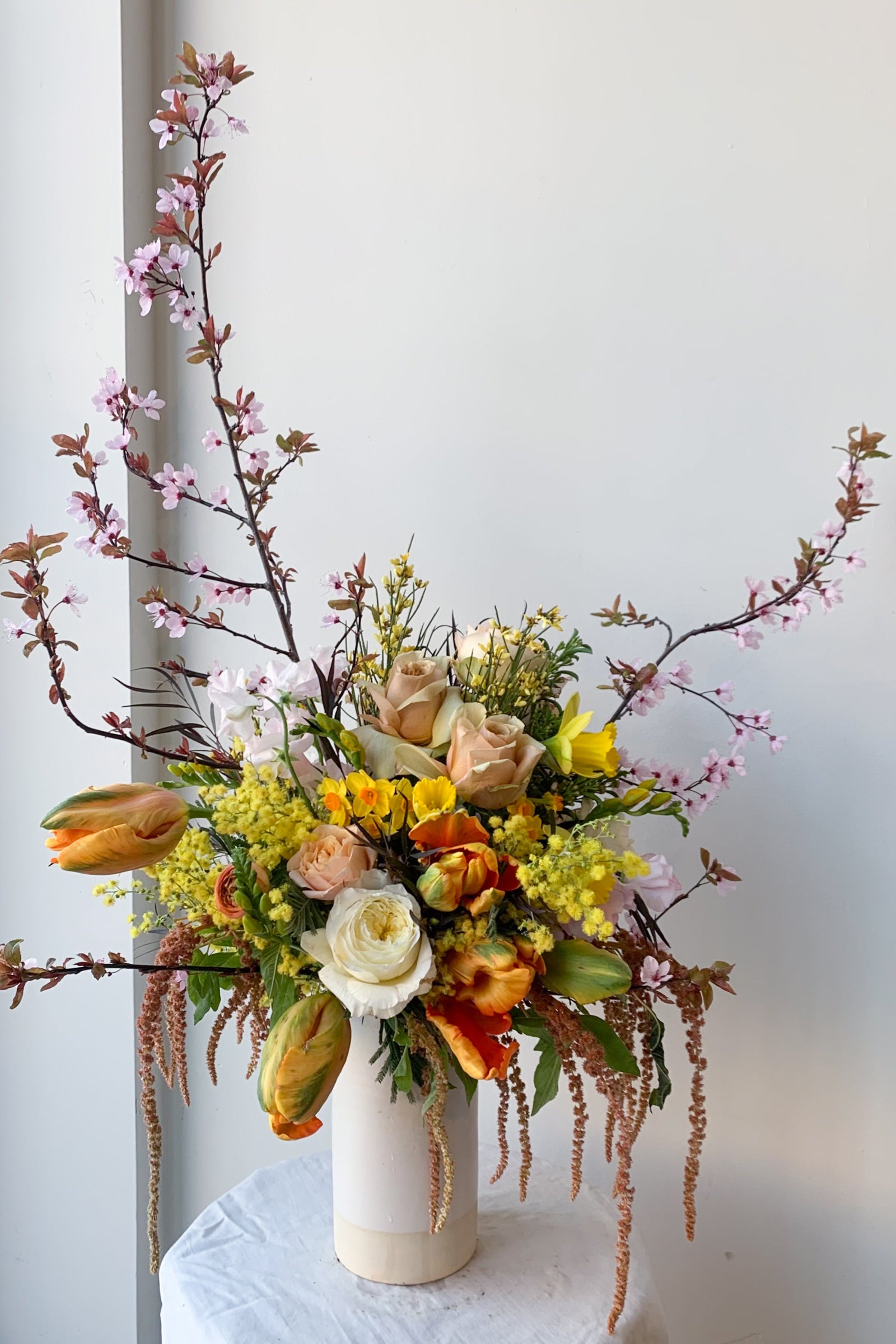 An example of Floral Arrangement Midday with cherry blossom branches and large tulips from Sprout Home in Chicago ©Sprout Home #size_$200