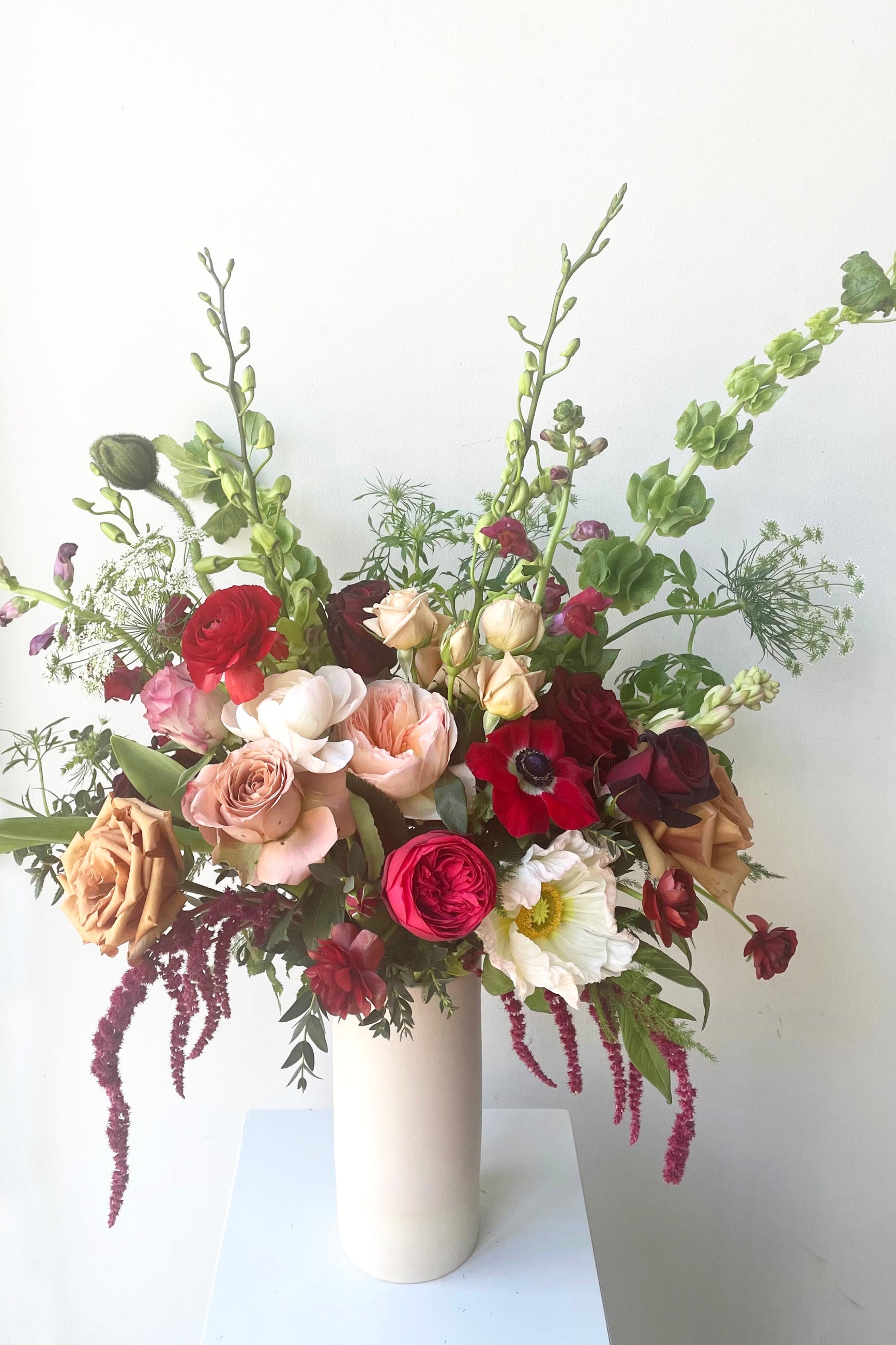 A vase holds an example of fresh Floral Arrangement Modern Love from Sprout Home Floral in Chicago for Valentine's Day ©Sprout Home #size_$160