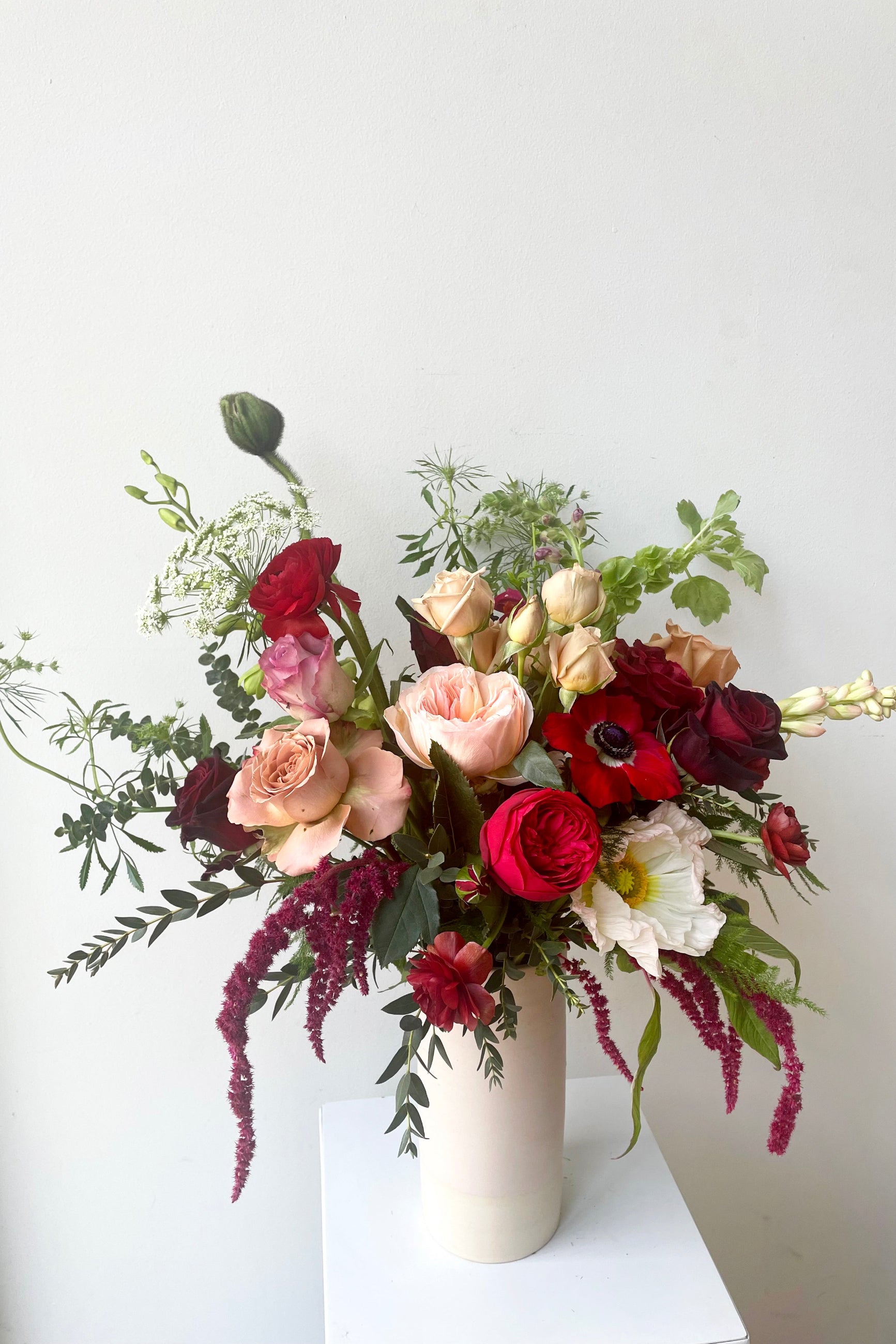 A vase holds an example of fresh Floral Arrangement Modern Love from Sprout Home Floral in Chicago for Valentine's Day ©Sprout Home #size_$125