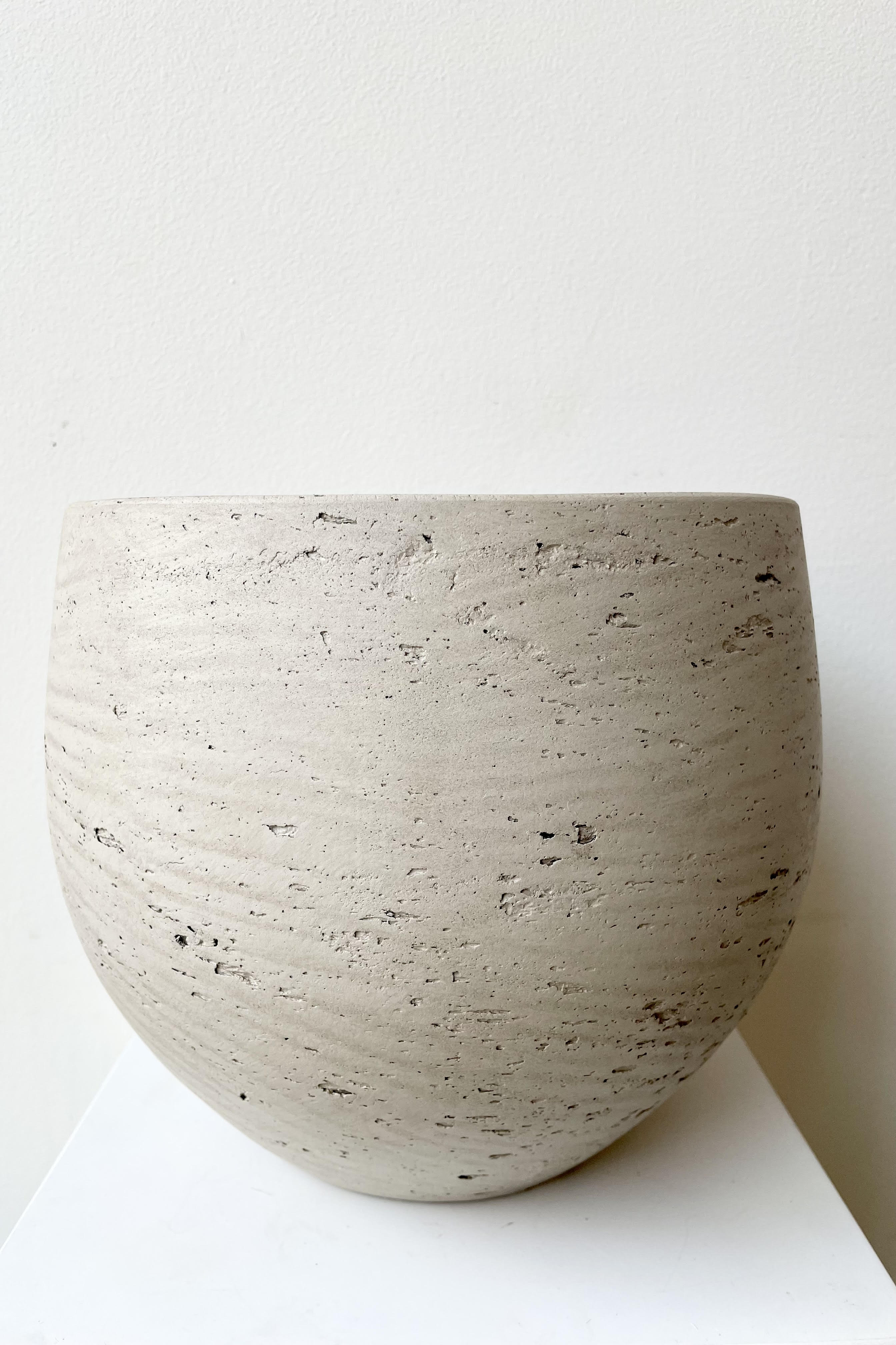 The Mini Orb grey washed medium sits against a white backdrop.