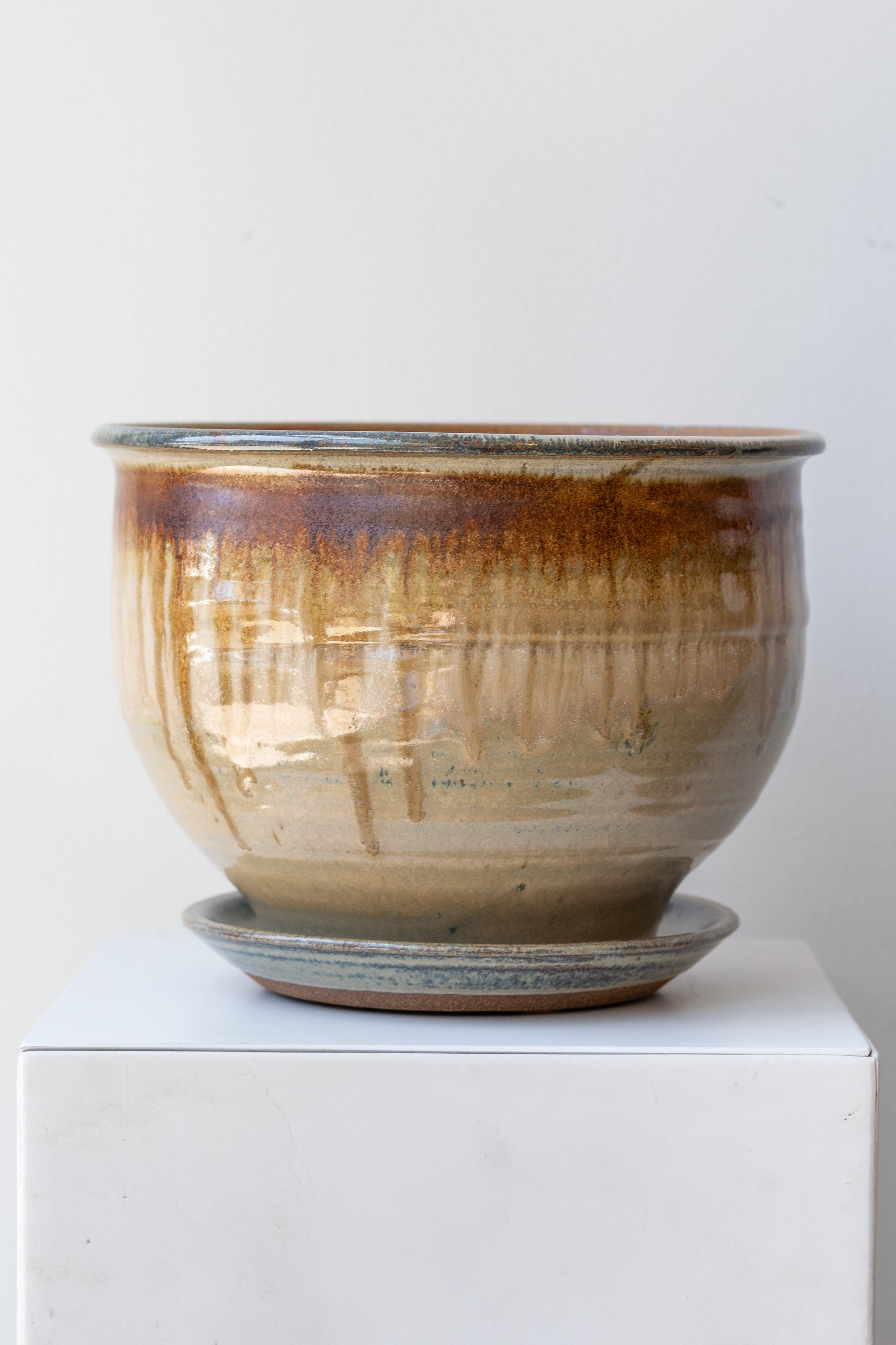Bruning Pottery Planter ivory & iron glaze - 8" on white surface in a white room