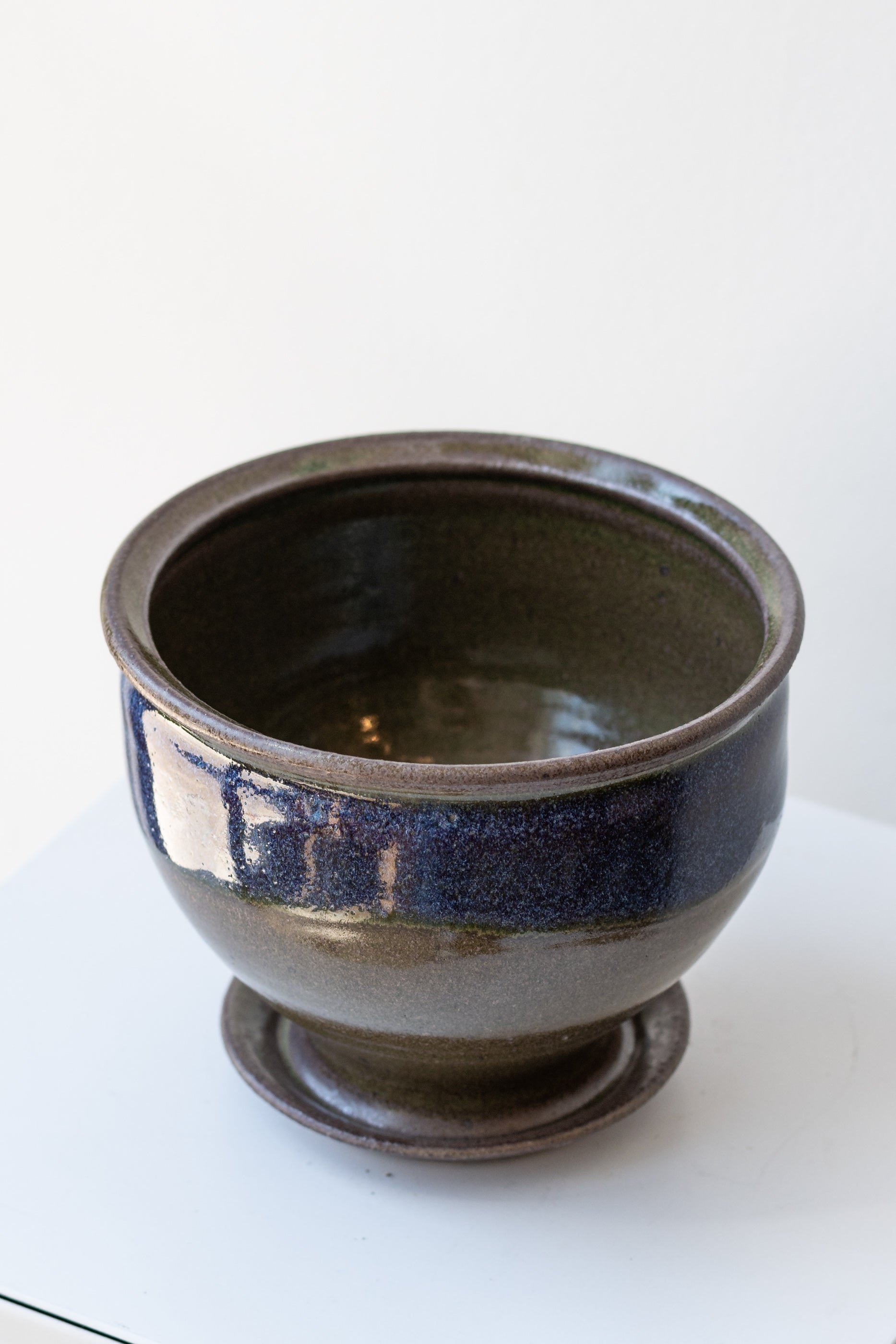 Bruning Pottery Planter moss & lilac glaze - 4" on a white surface in a white room