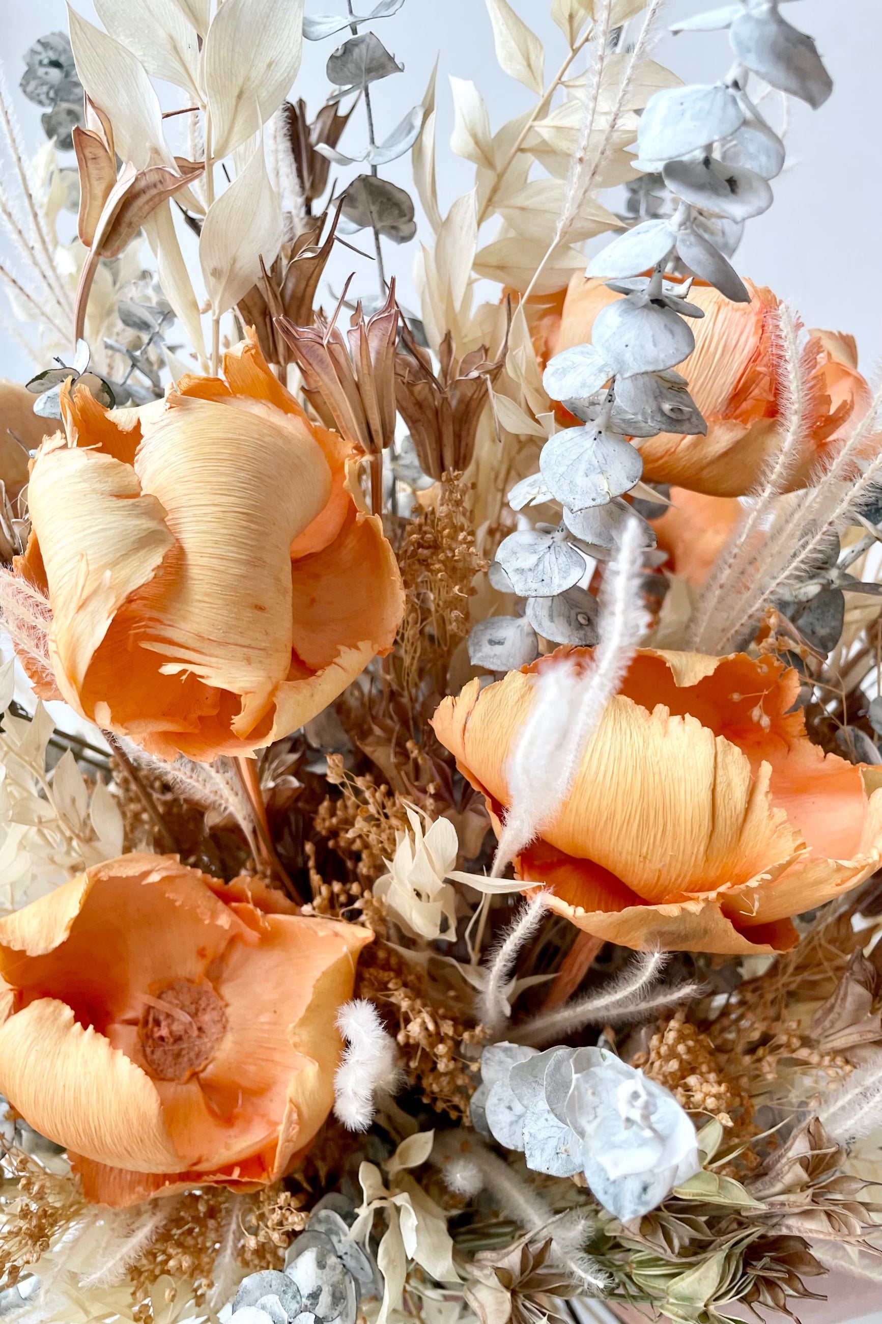 A close-up view of the $200 option for Preserved Arrangement Creamsicle by Sprout Home against a white backdrop ©Sprout Home #size_$200