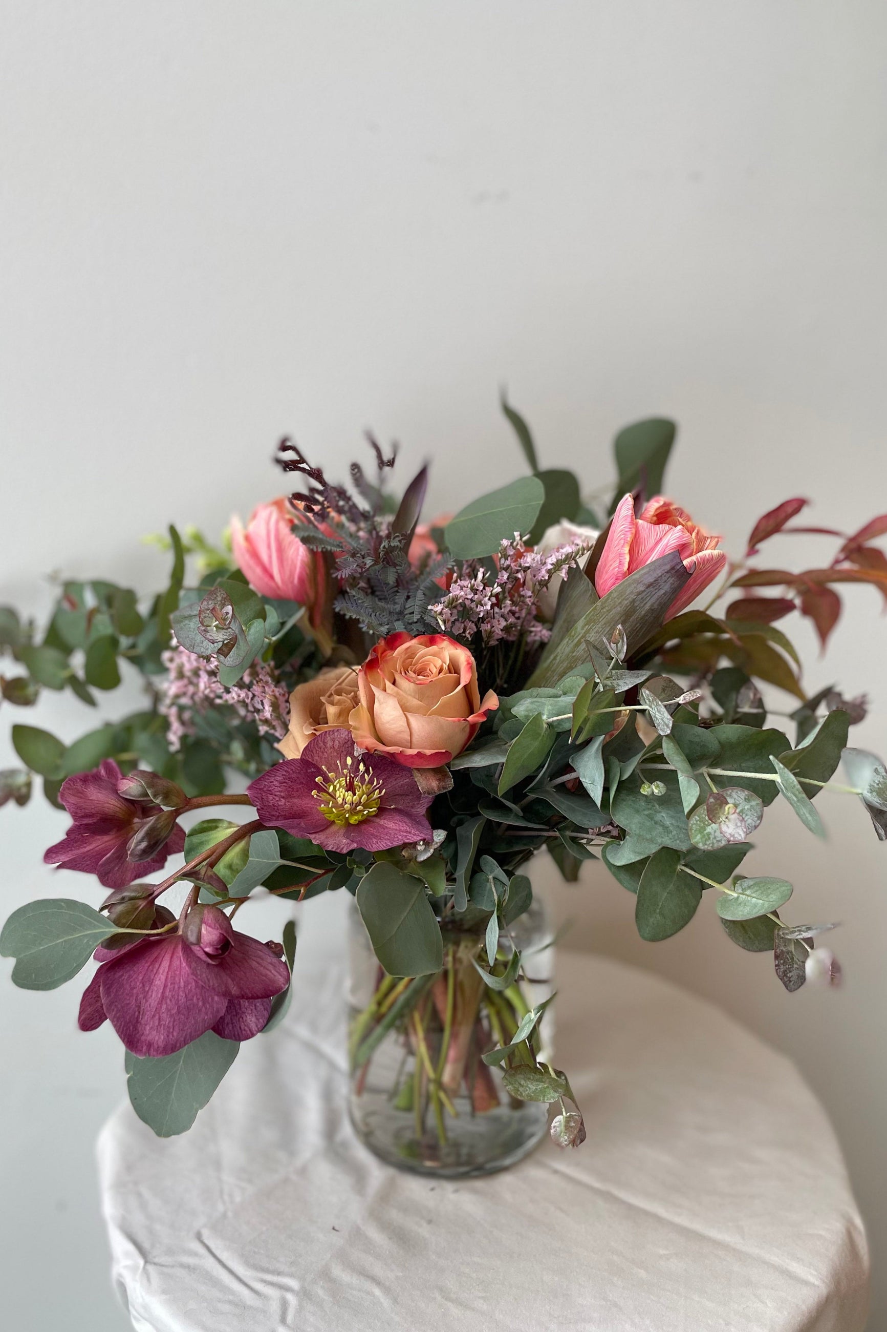 A sweet, warm and fuzzy arrangement by Sprout Home floral featuring plum tones ©Sprout Home #size_$75
