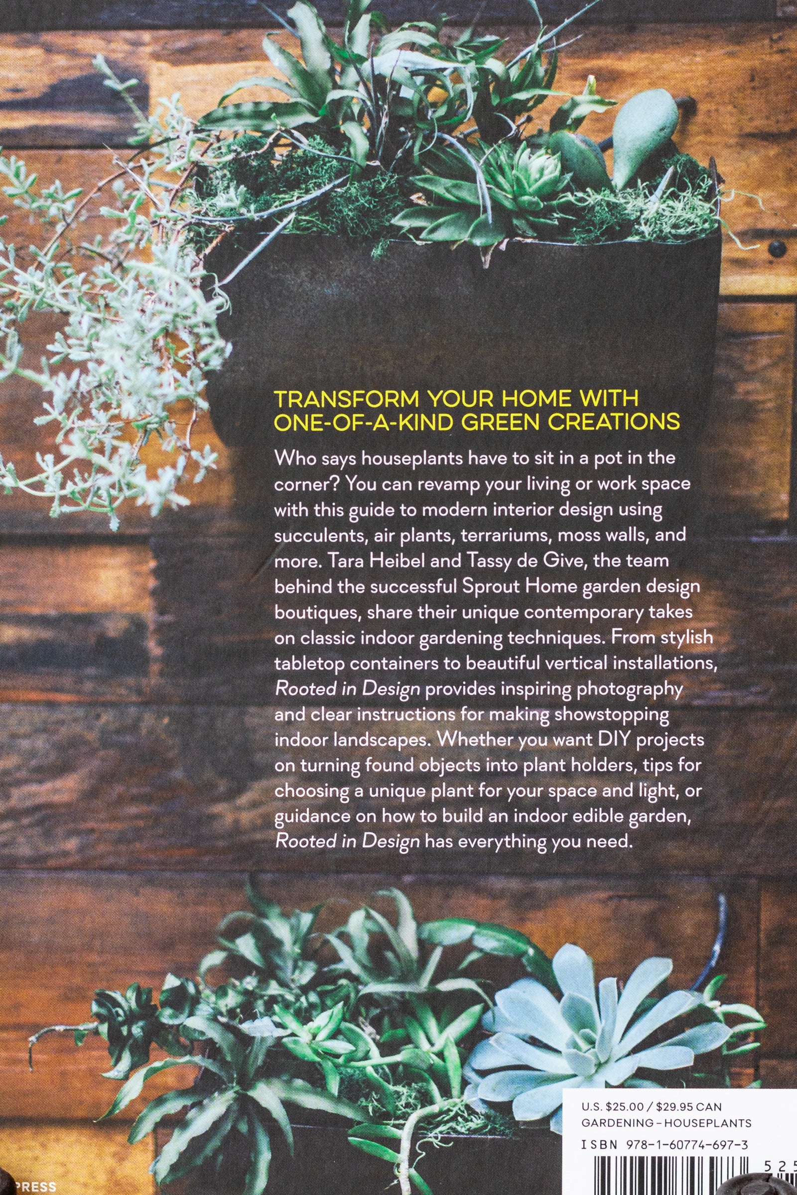 Zoomed in view of the back cover of the book "Rooted In Design." The back cover has a picture of two succulent wall planters on a brown wood wall.