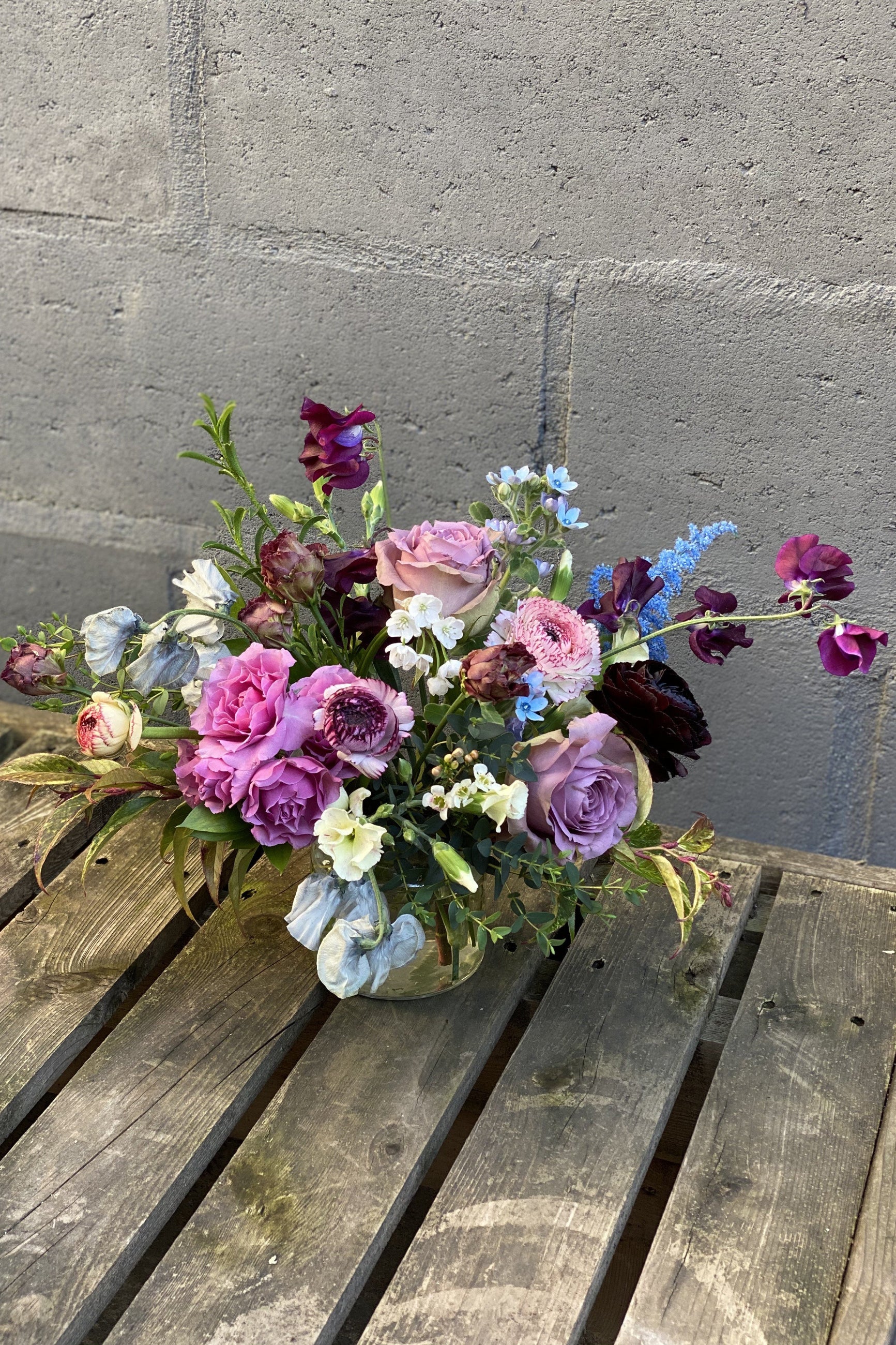 Storm custom arrangement by Sprout Home featuring purple roses ©Sprout Home #size_$130