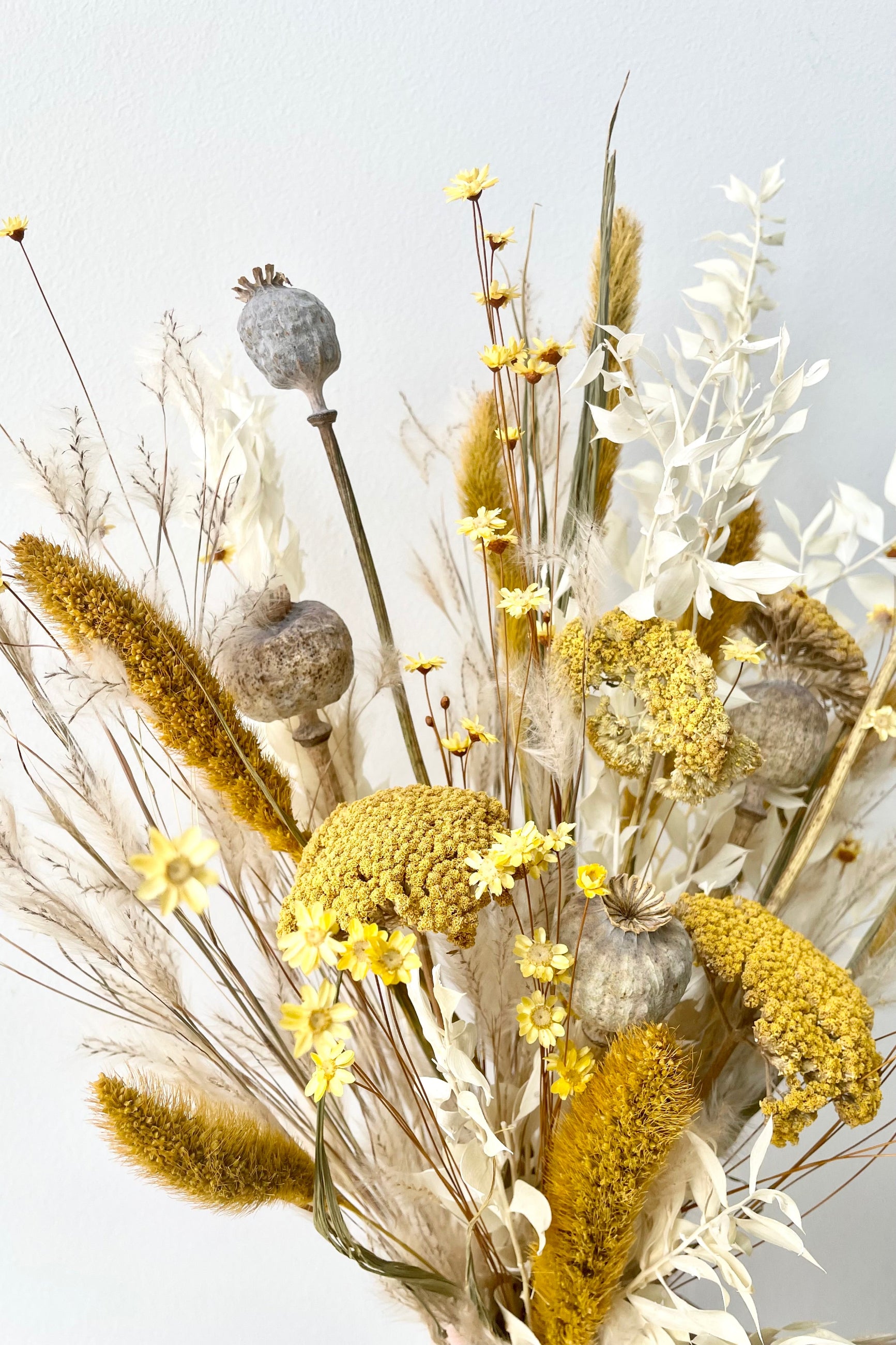 Different types of dried floral with the colors yellow, white and tan in front of white background. ©Sprout Home #size_$85