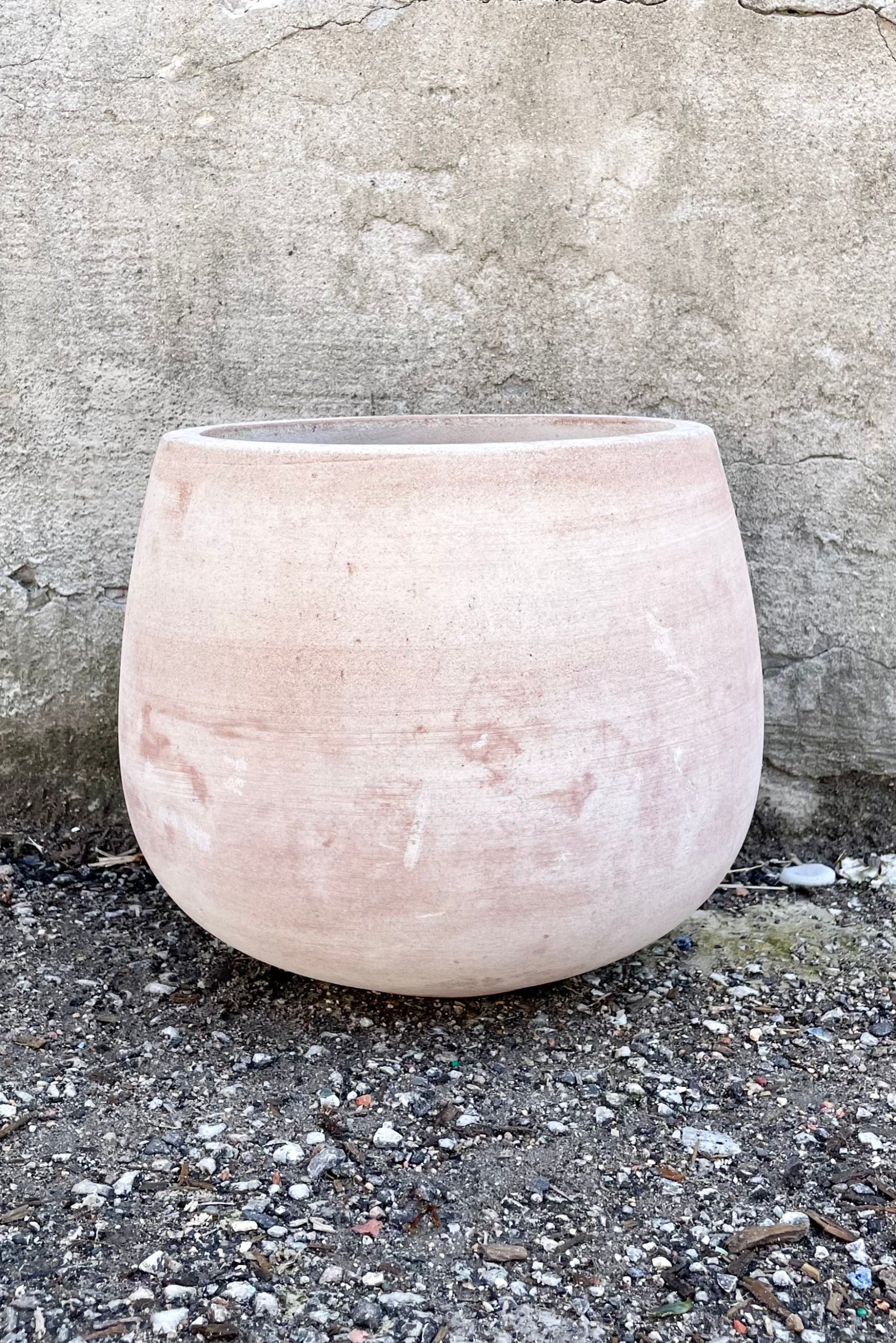 Yumiko Unglazed Planter Small against a grey wall ©Sprout Home