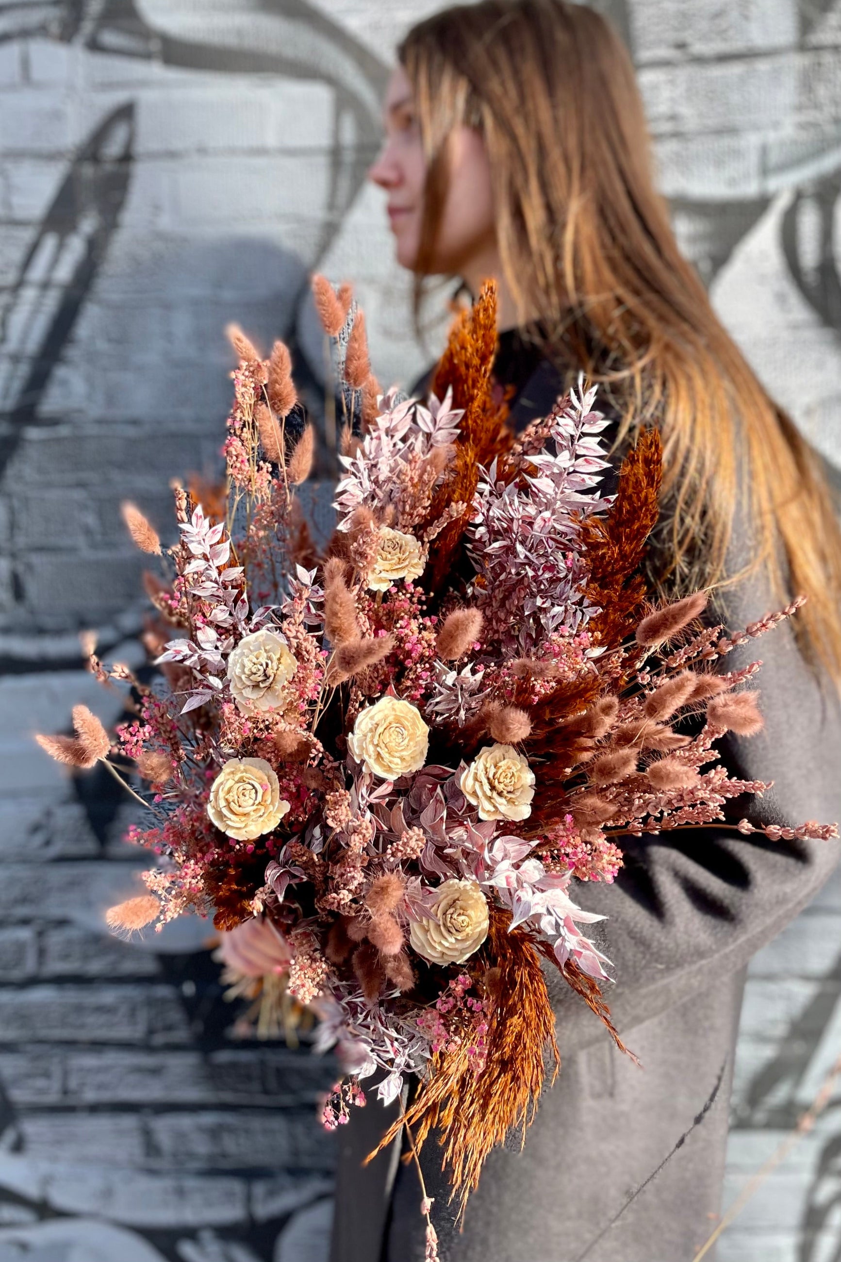 Ambrosia preserved arrangement against a grey graffiti wall. ©Sprout Home #size_$160