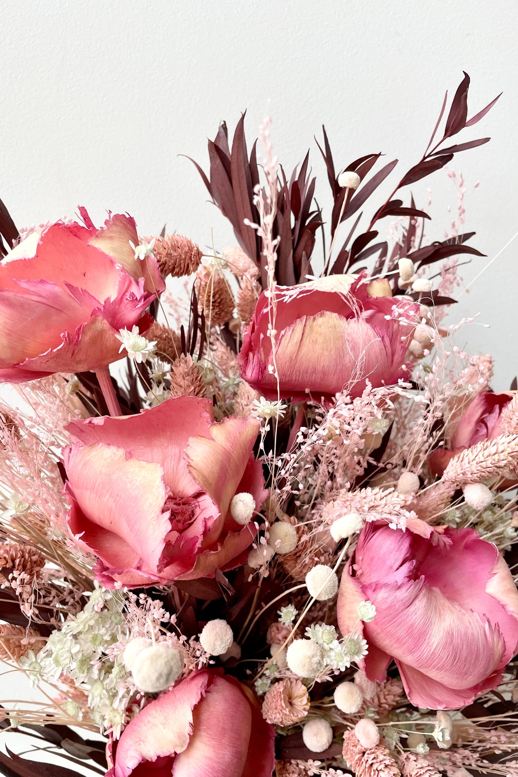 Sprout Home's Chocoberry Milkshake arrangement up close detail of the pink flowers and chocolate colored foliage. ©Sprout Home #size_$200