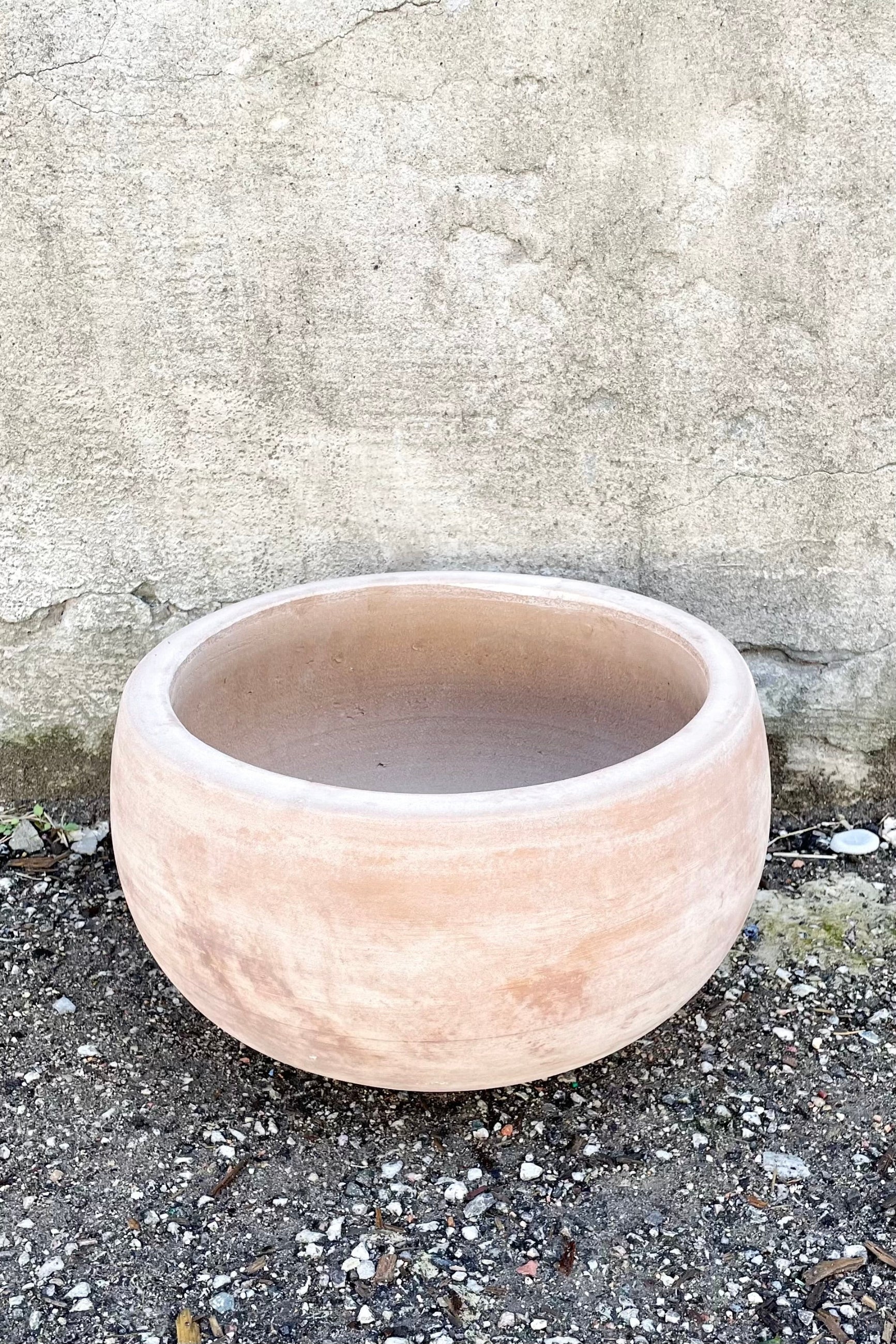 detail of Yumiko Unglazed Bowl Small against a grey wall ©Sprout Home