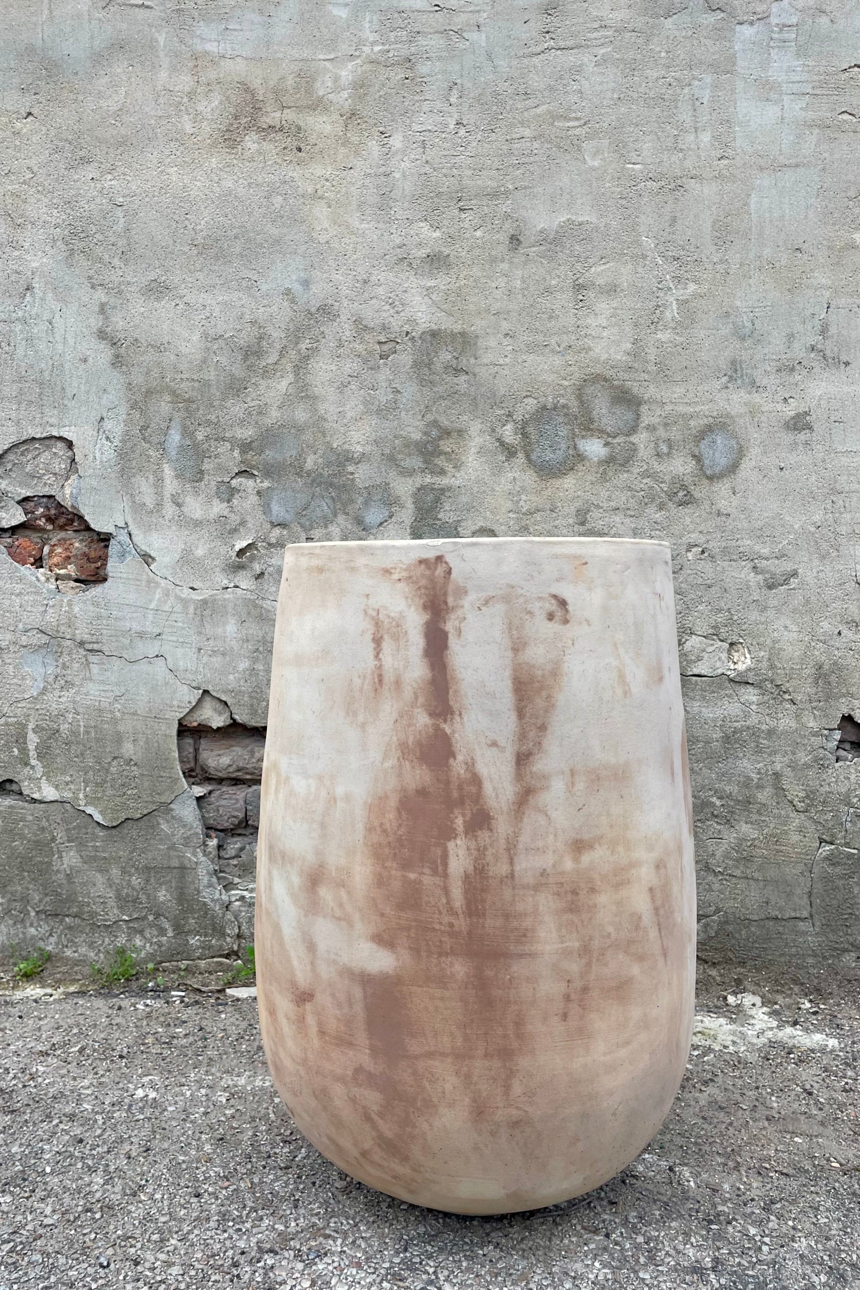 Yumiko Unglazed Crucible Large against a grey wall ©Sprout Home