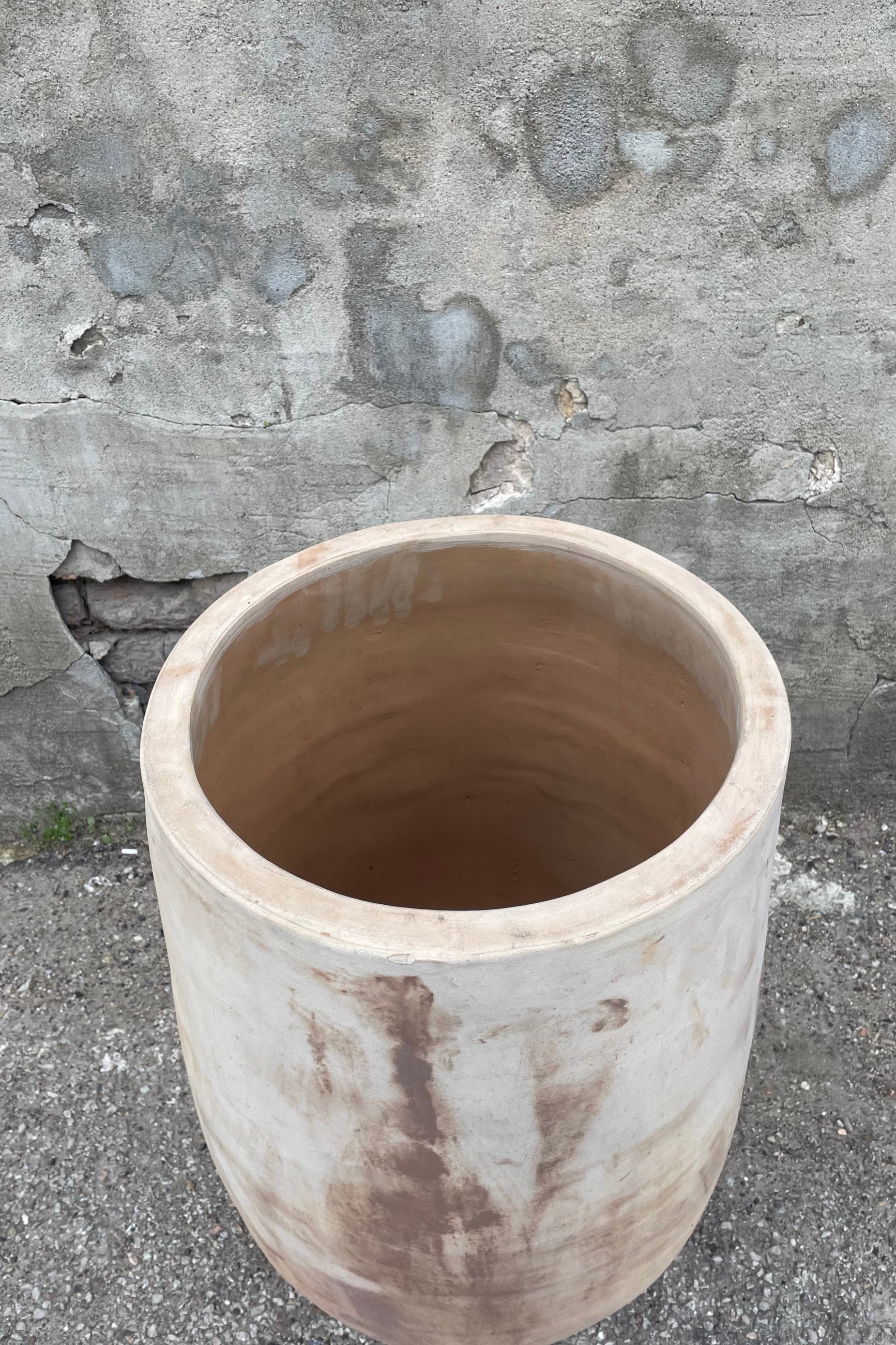 Yumiko Unglazed Crucible Large against a grey wall ©Sprout Home