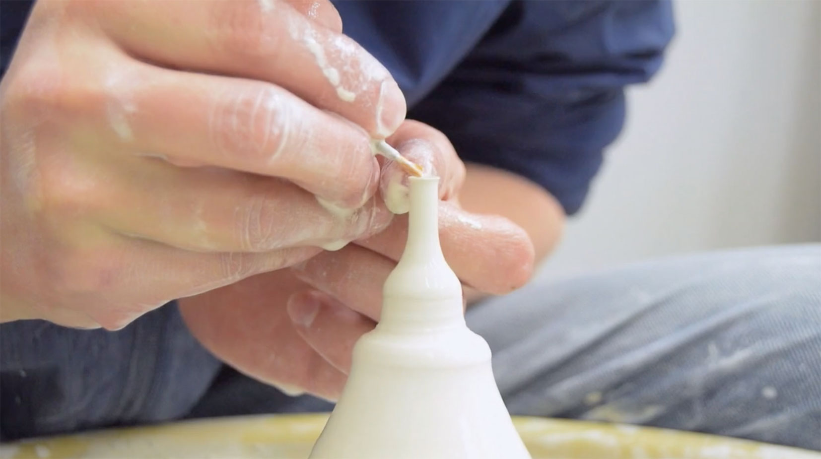 a person hand crafting a miniature vase ©SGW Lab