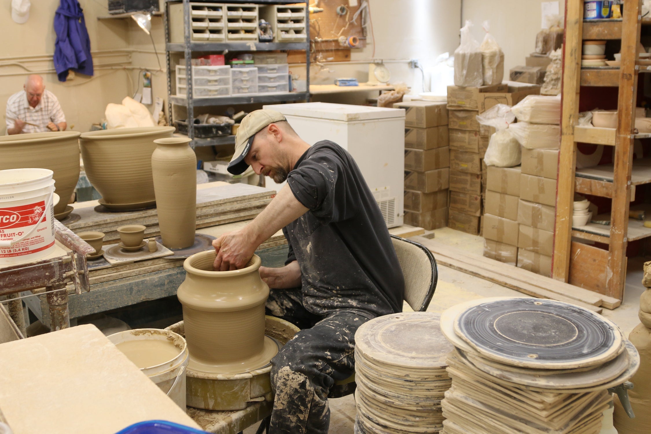 Ky, on the potters wheel at Bruning Pottery ©Bruning Pottery