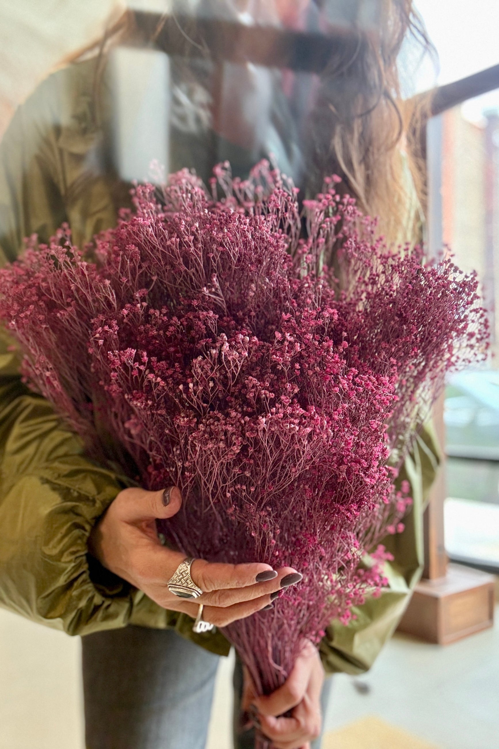 Person holding a bouquet Brooms Dusty Antique Rose Color Preserved Bunch indoors ©Sprout Home