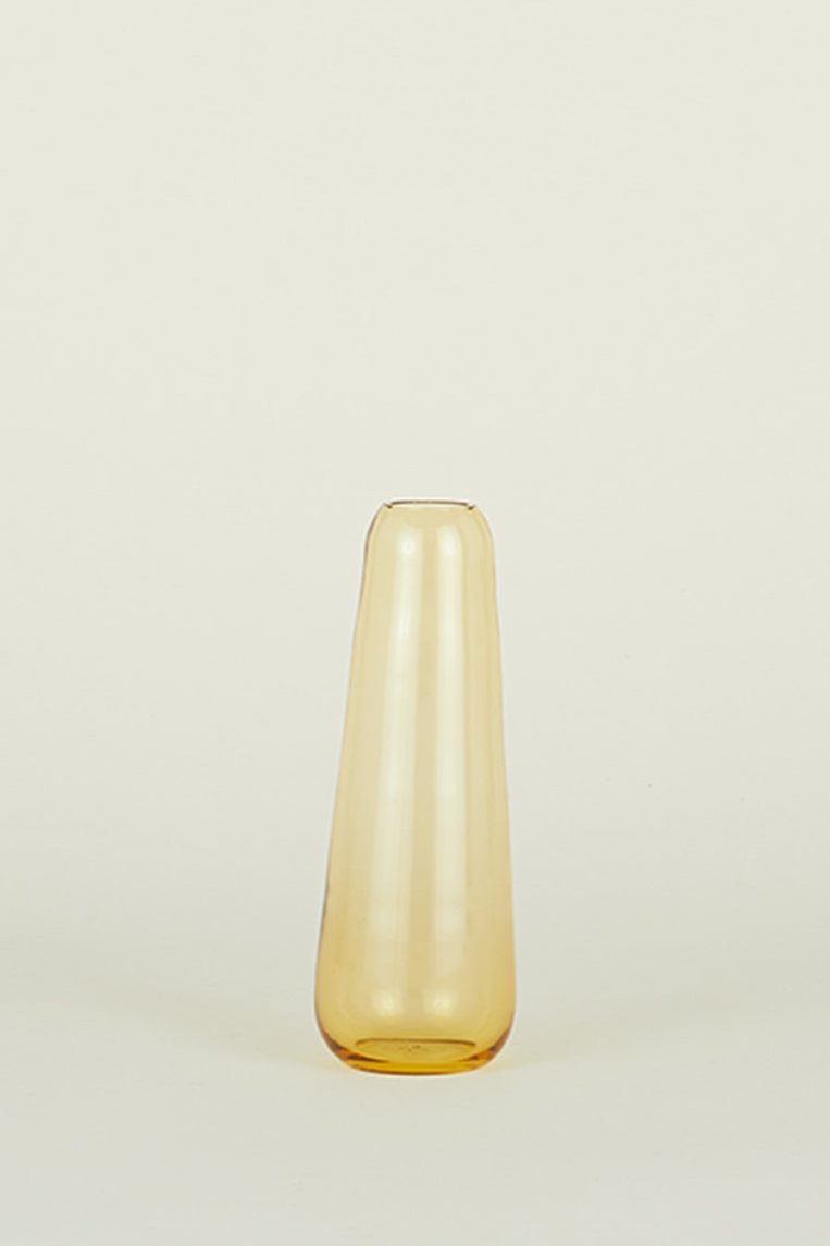 Aurora Slim vase in Amber from Hawkins new York shown at eye level.