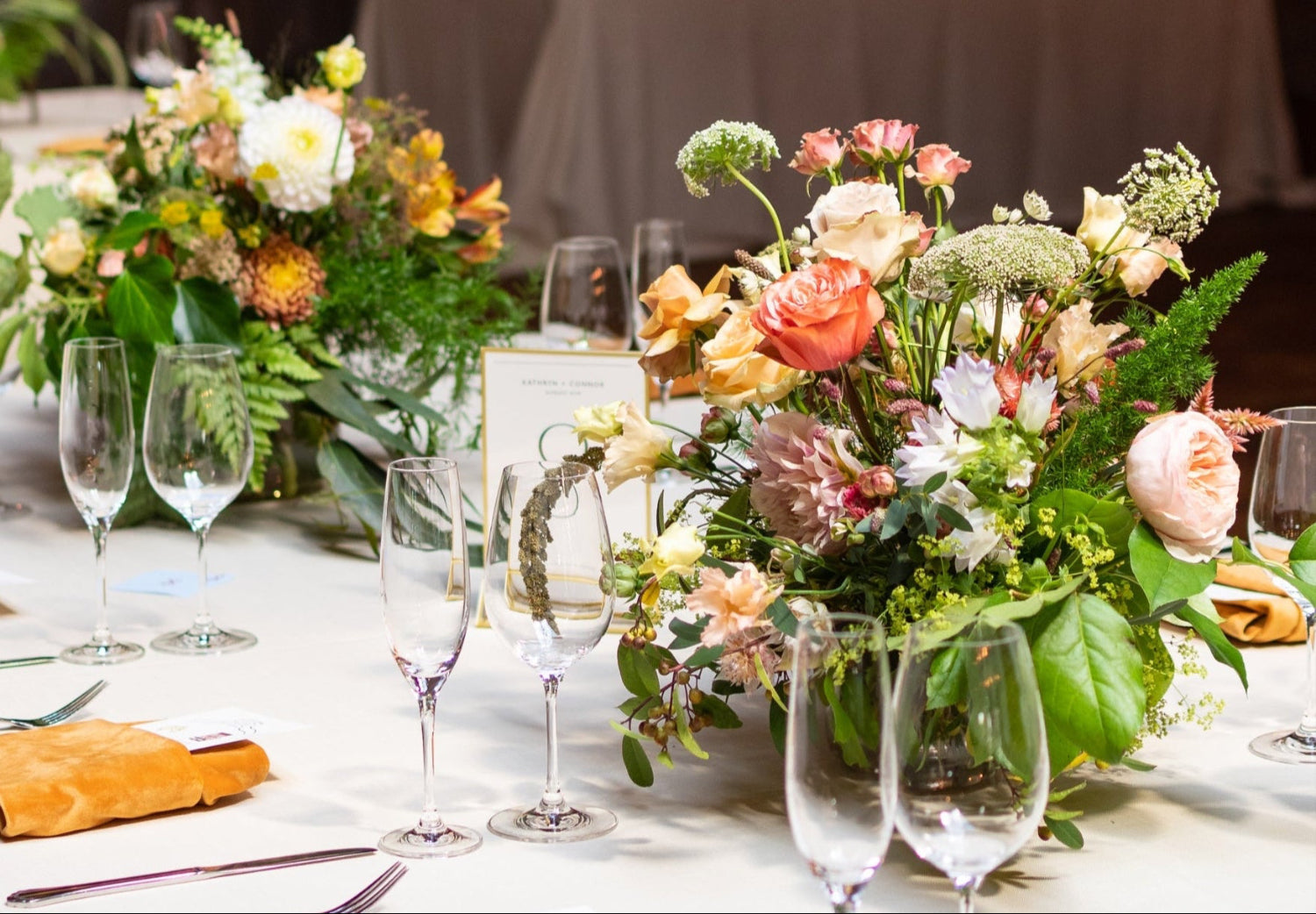 Light and warm floral centerpieces by Sprout Home for a clients wedding