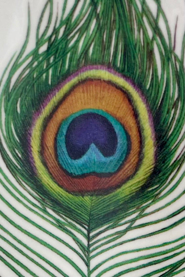detail picture of the center of the peacock feather tattoo,