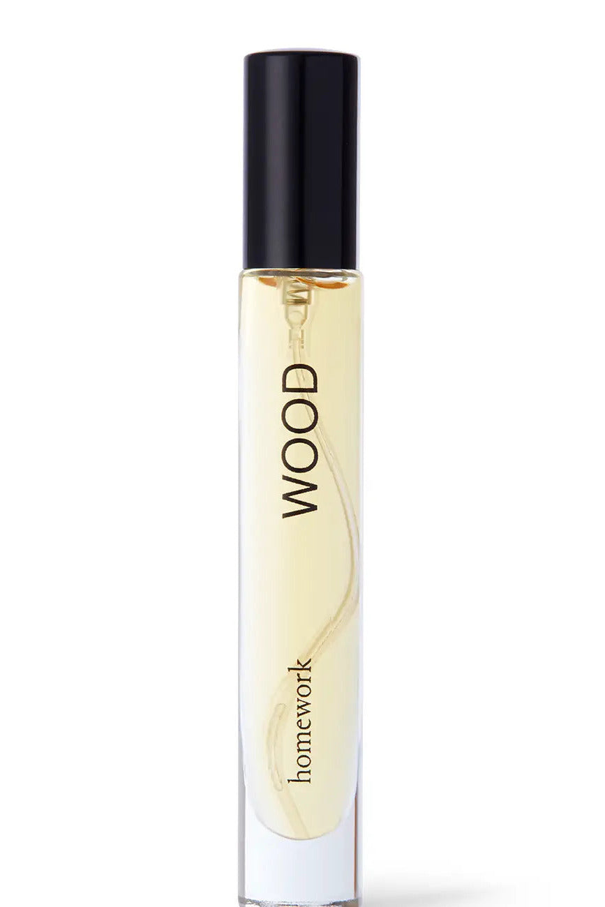 Perfume bottle labeled 'homework wood' on a white background  ©Homework