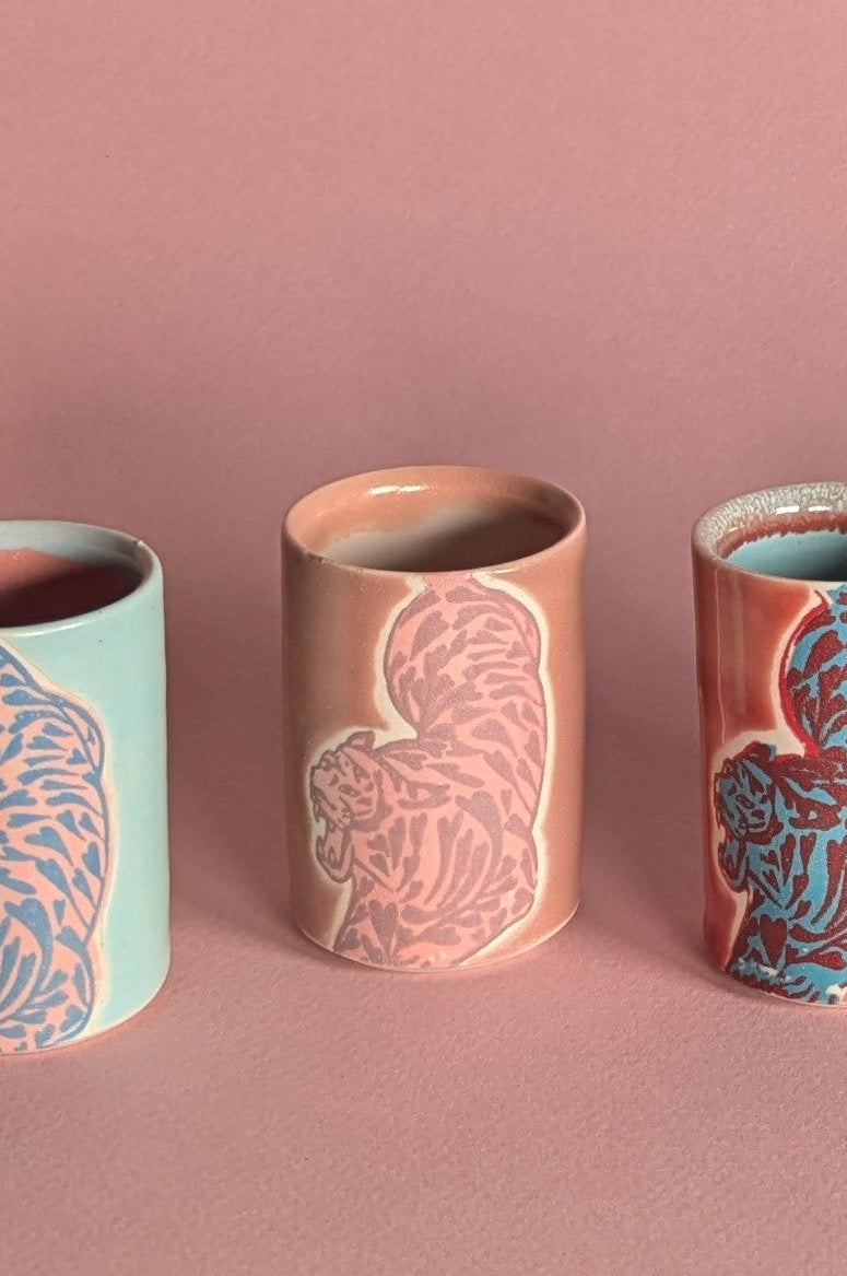 Set of tiger ceramic cups with on a pink background ©City in Bloom Ceramics