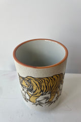 Photo looking down on a tiger ceramic tea cup