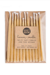 Knot & Bow Short Natural beeswax candles in their packaging.