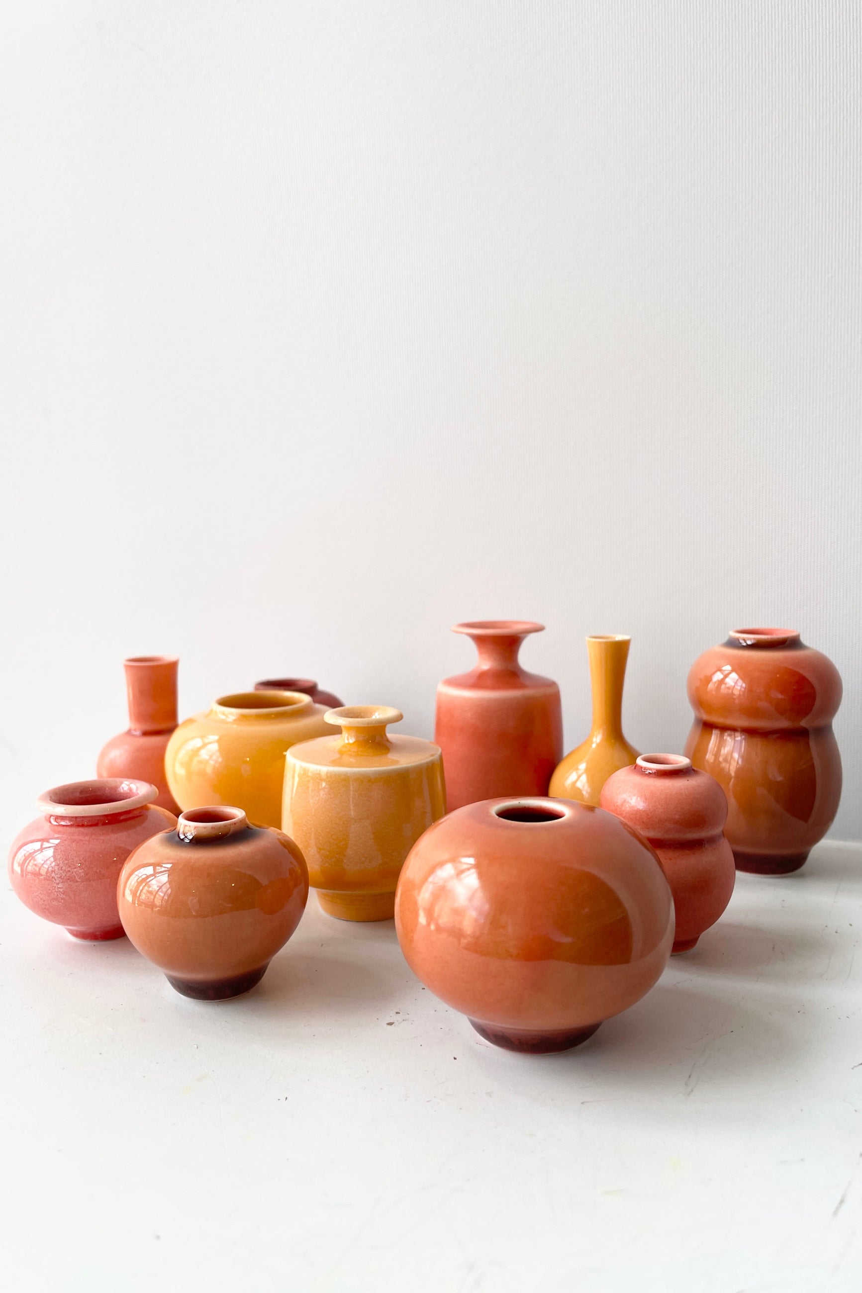 Handmade ceramic vases in orange by Yuta Segawa at Sprout Home. ˙©Sprout Home