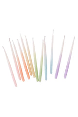 Knot & Bow rainbow ombre short beeswax candles out of their package on white.