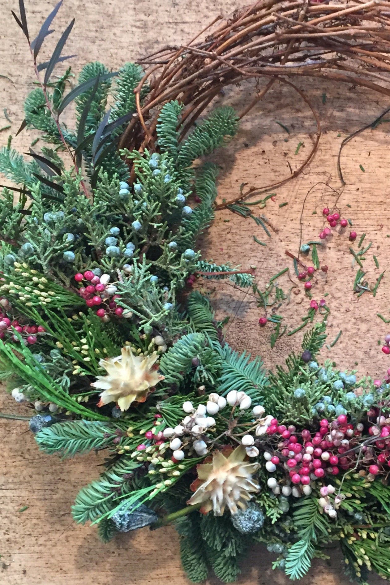 An evergreen wreath on a blank background ©Sprout Home