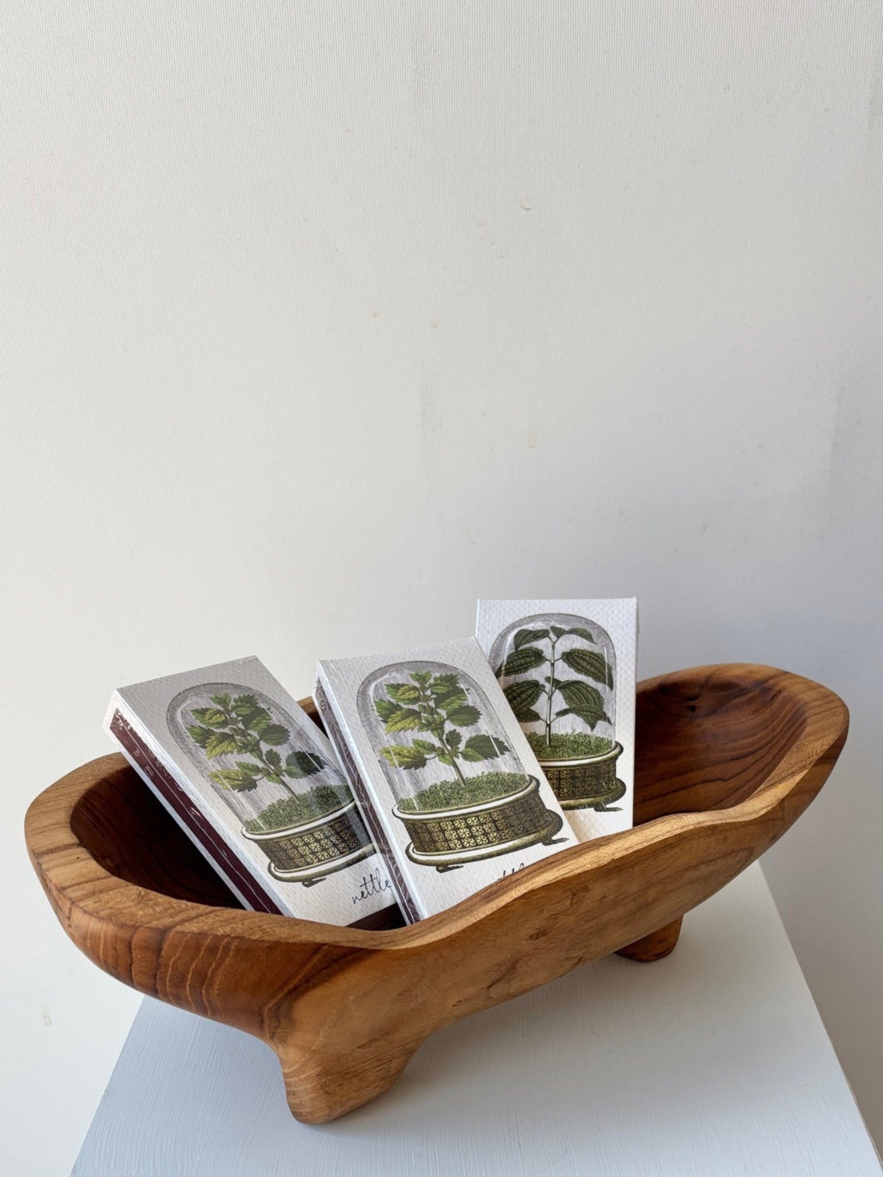 Wooden wavy footed bowl with matchbox ©Sprout Home