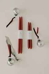 Mo & Co berry red beeswax candles with disco balls