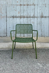 The green martini low profile chair viewed from the front at eye level. 