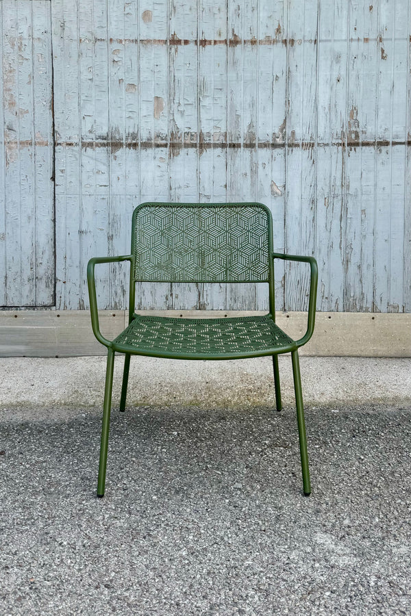 The green martini low profile chair viewed from the front at eye level. 