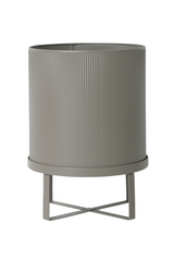 Warm Grey Bau pot by Ferm Living shown empty and from the side spotlighting the vertical ridges.