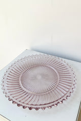 Dentelle Blush Aurora Glass Plate viewed from the side top.