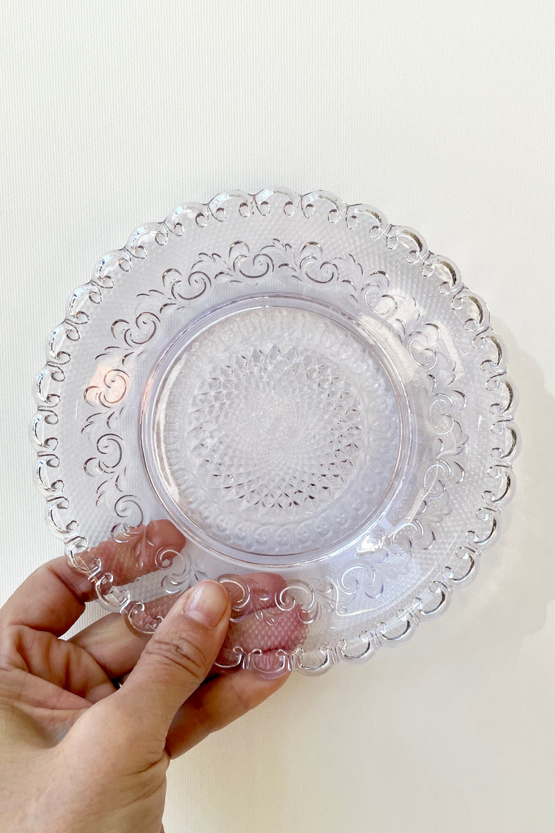 Dentelle Amethyst Chantilly Glass Plate being held against a white background
