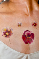 Detail of the Tattly Wild Pansies Tatoo's applied to the skin.